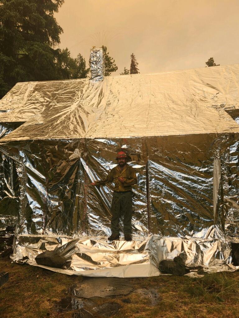 Crews worked to protect the historic Gotchen Cabin