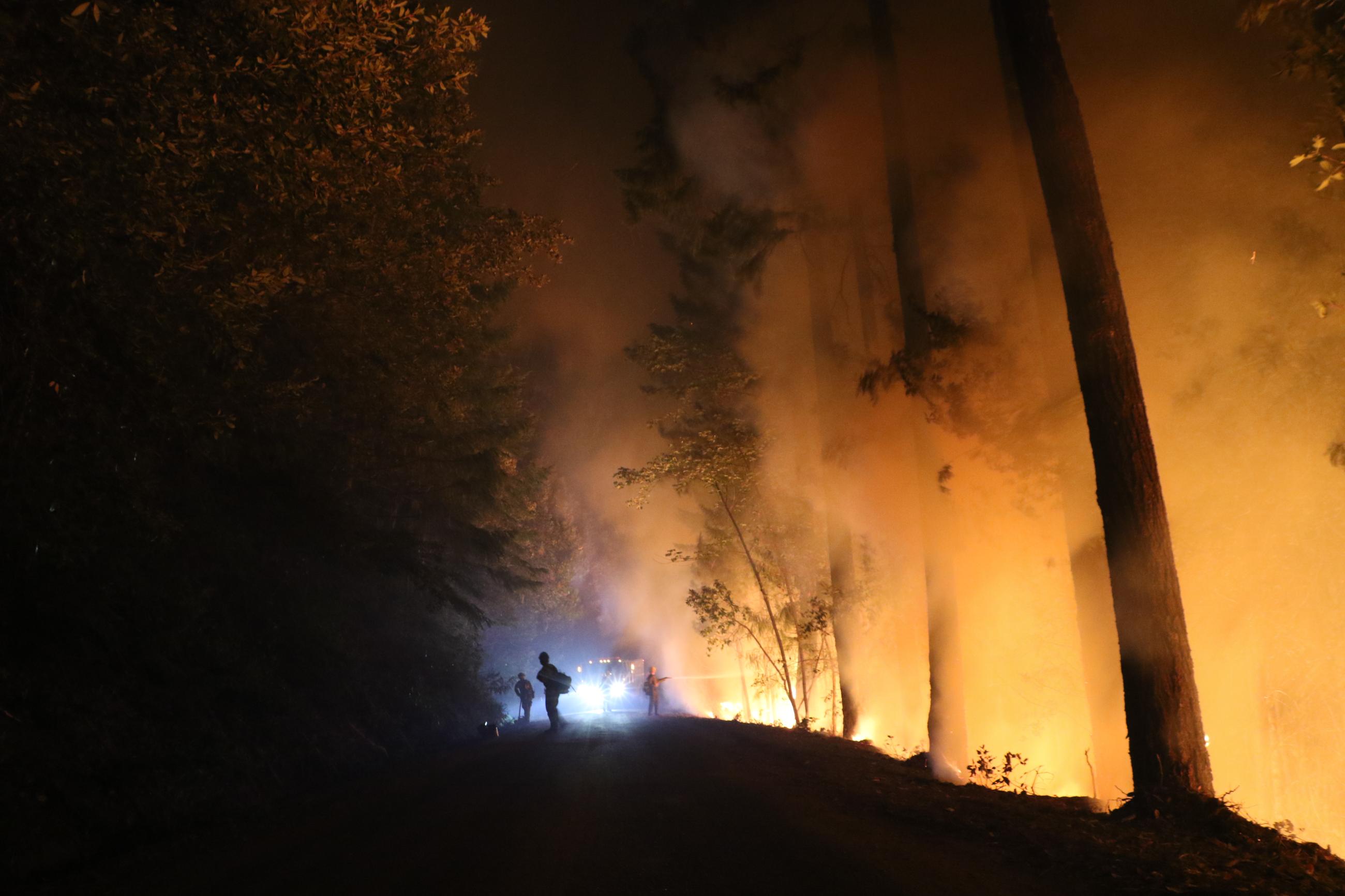 Night firing operations on the fire's southwest edge