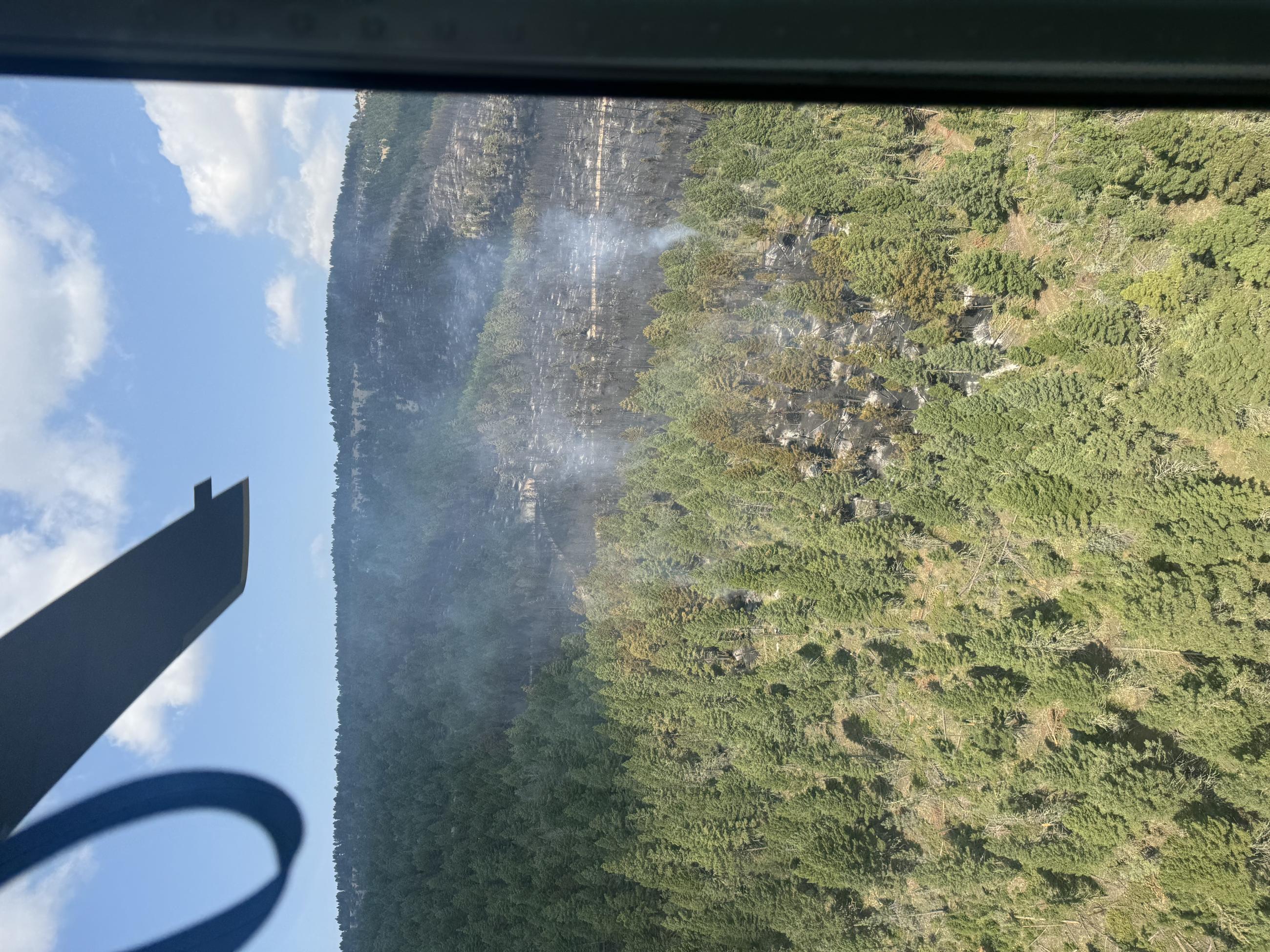 Aerial view of Black Canyon Fire burning in heavy timber