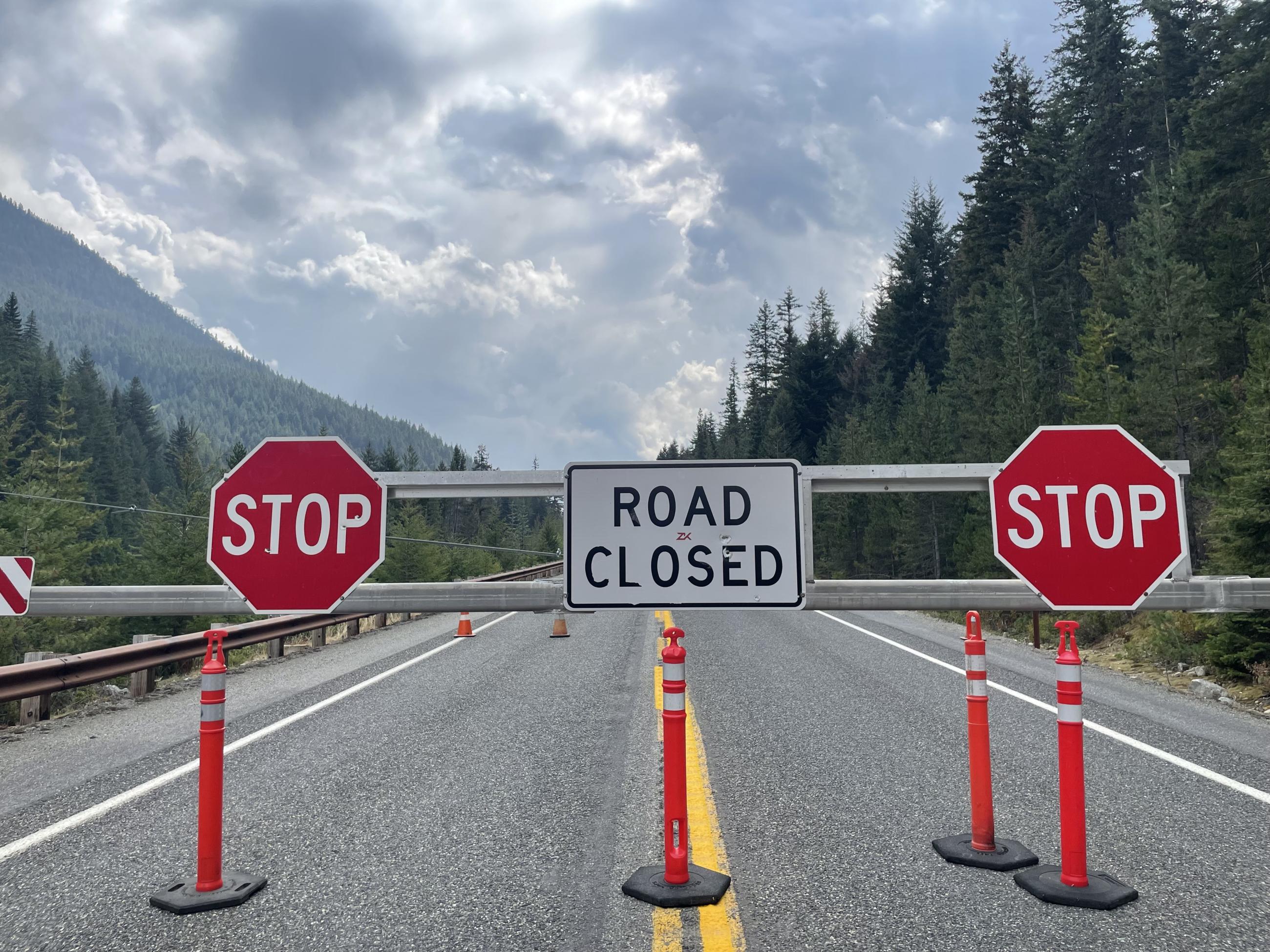 Photo - Road closure signs and barricade on State Route 20 milepost 148