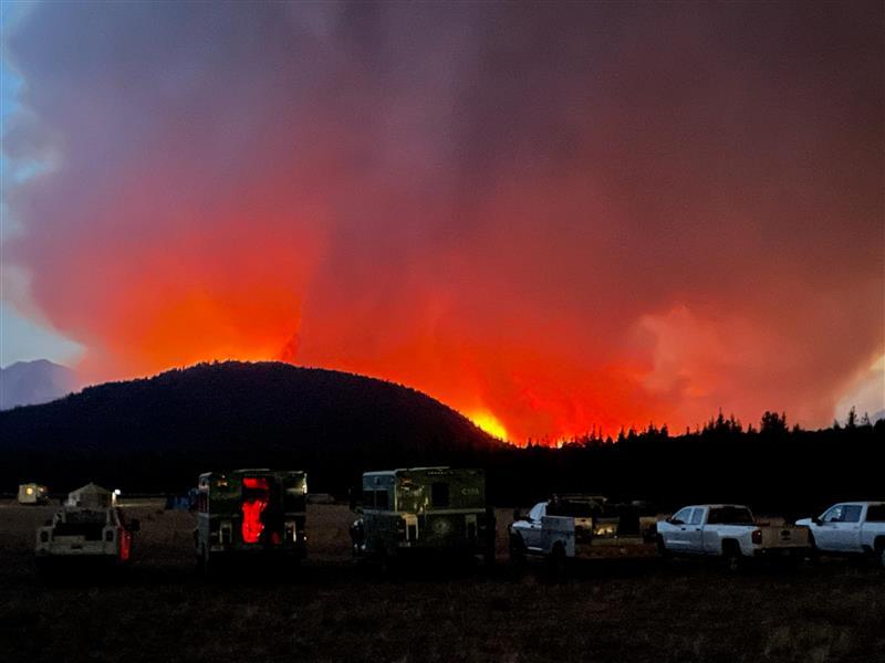 The sky glows orange as fire activity nears incident command post, Thursday, August 22