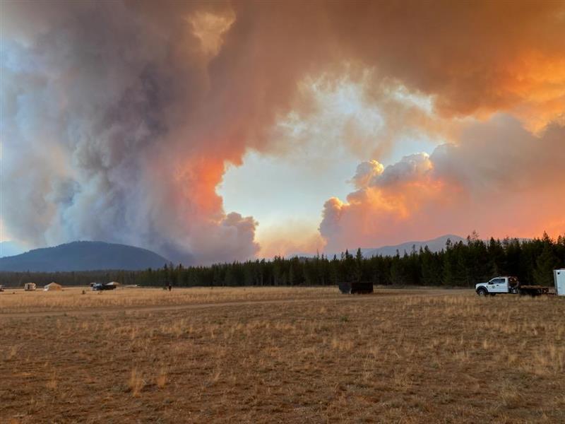 Two Large Smoke Columns from the Wapiti Fire rise from mountains  on Thursday, August 22