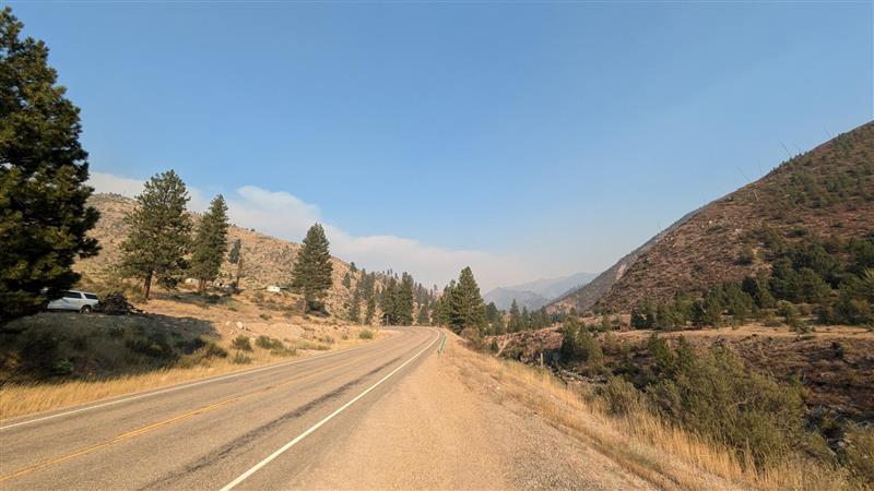 blue skies but smoke in distance seen  from Lowman 8-28-2024