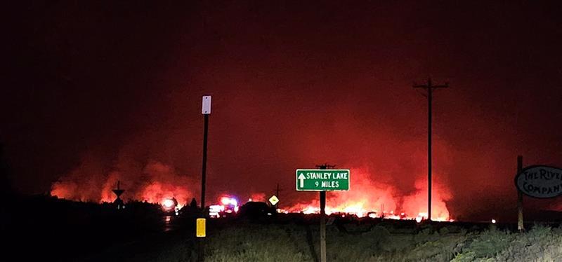 Fire in the distance at night west of Stanley, Aug 26