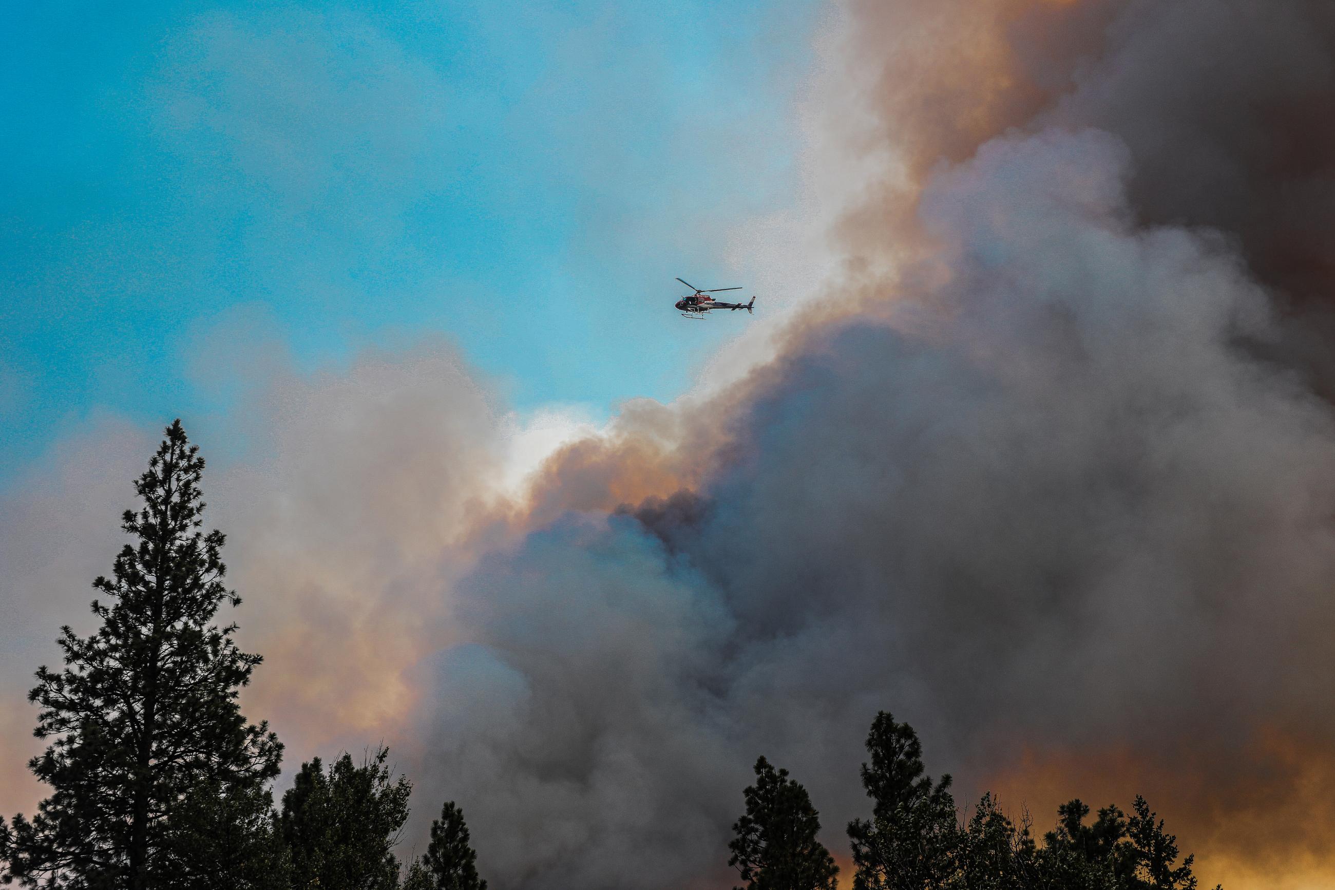 Photo of smoke and a helicopter