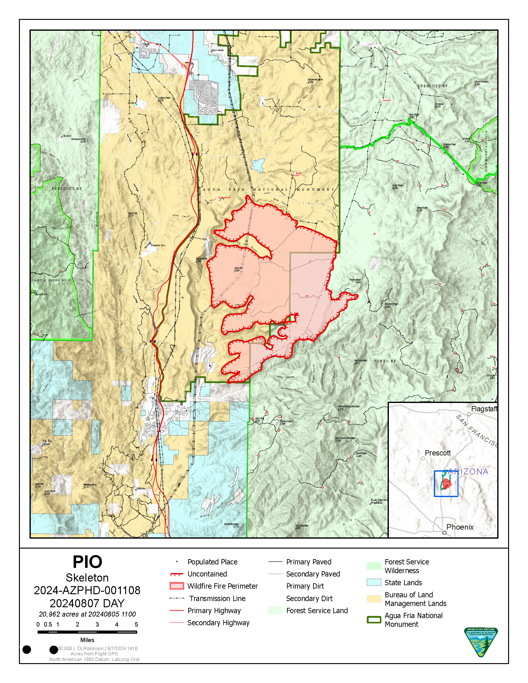 Map of the Skeleton Fire location shows Interstate 17 running north-south through the center of the map. The Agua Fria National Monument, in yellow is to the east of the Interstate and the Tonto National Forest in green in is east of the Agua Fria National Monument. A red overlay shows the fire location on mesa tops with canyons cut in between fingers of the mesa