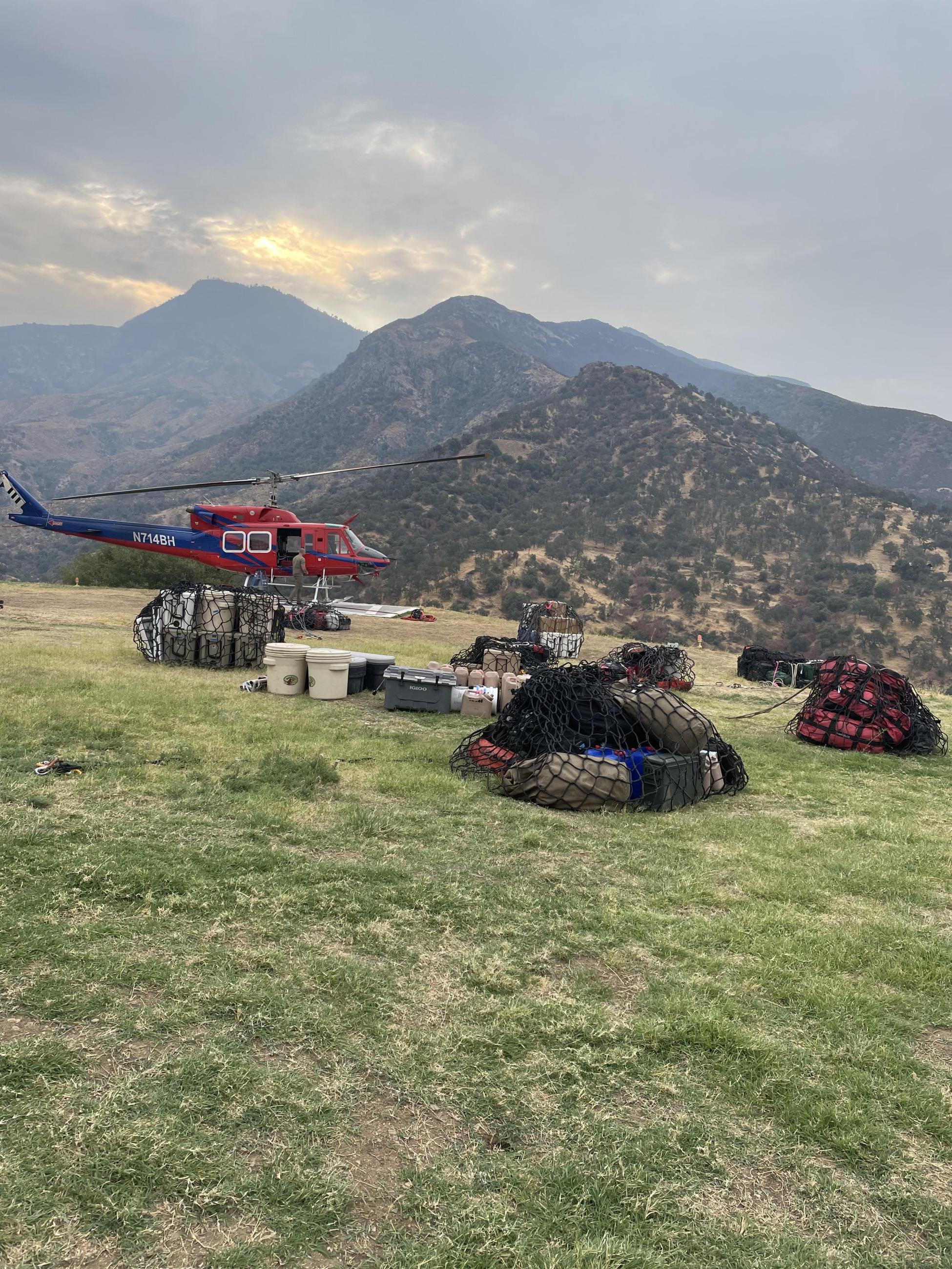 August 24,2024, showing Ash Mt Helibase slinging operations. Preparing to sling in Wildland Fire Modules gear into spike camp.