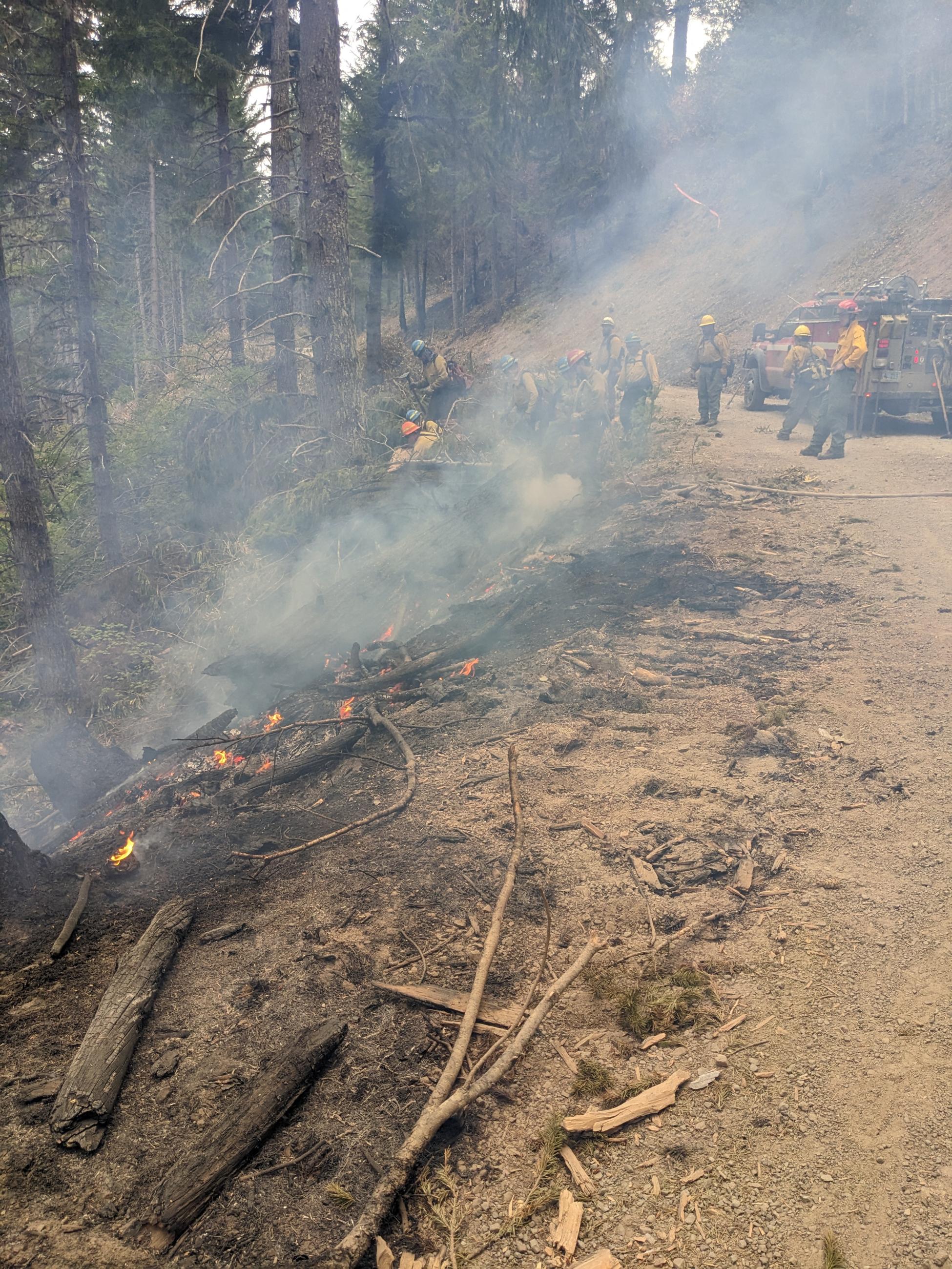 crew working smoking steep slope