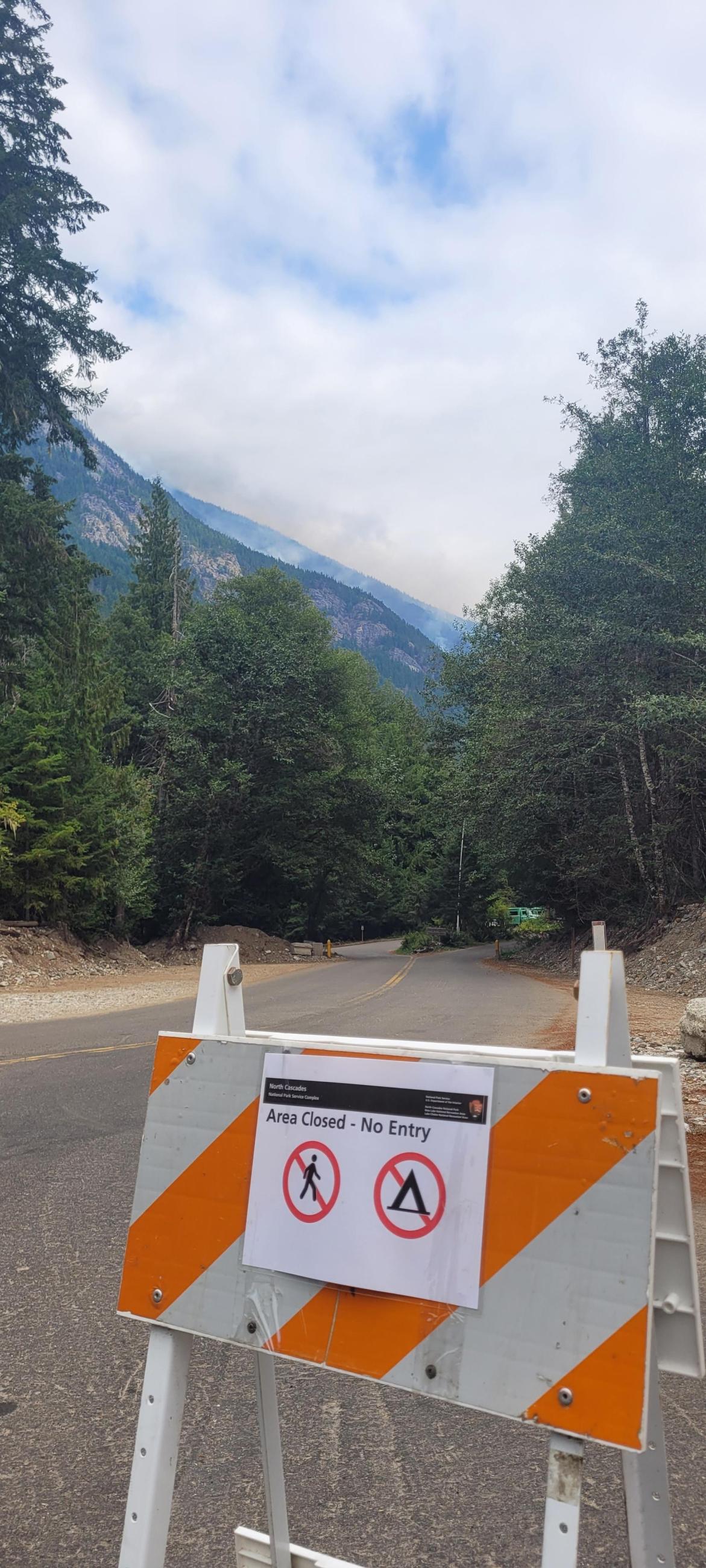 View of the fire from the entrance to the closed Colonial Creek South Campground