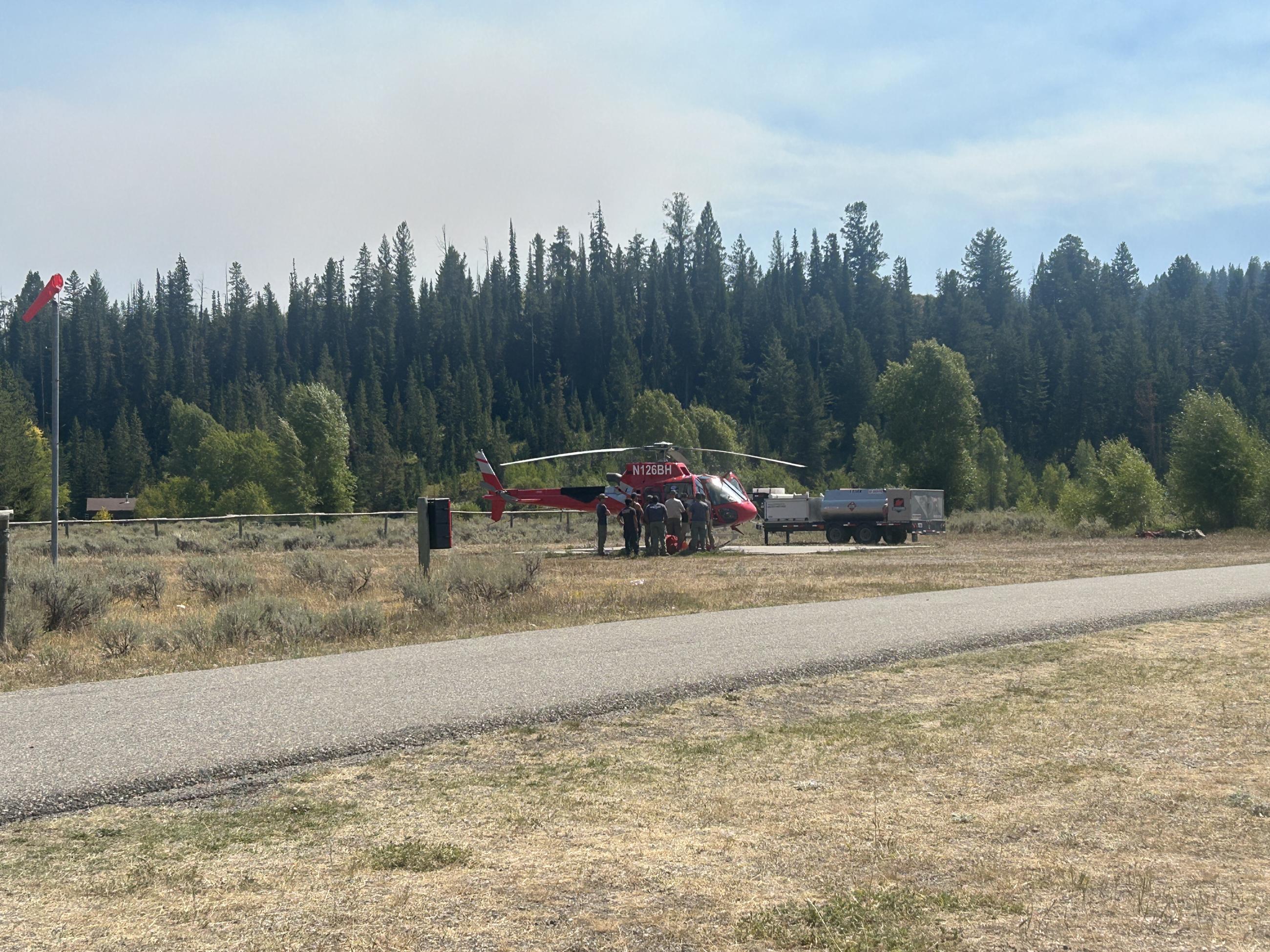 Helicopter with people getting briefed 