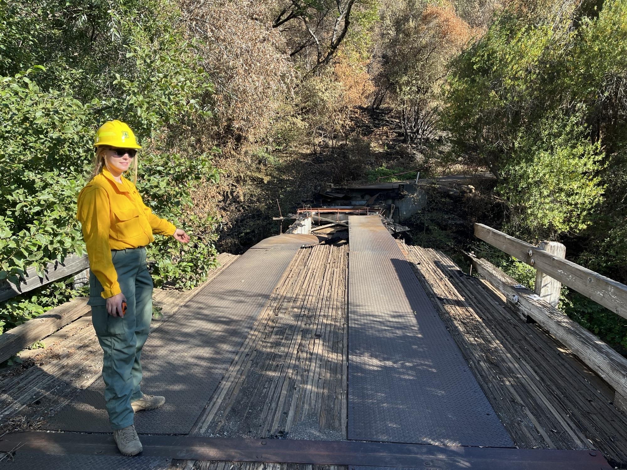 Image showing V=BAER Engineer Nicole Thompson Assessing Black Rock Bridge Damaged in Park Fire