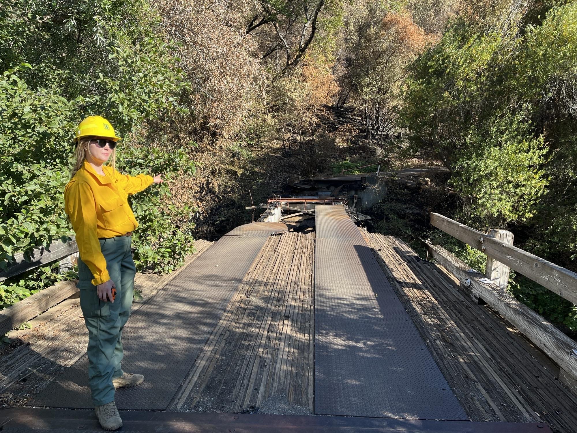 Image showing BAER Engineer Nicole Thompson Assessing Black Rock Bridge Damaged in Park Fire