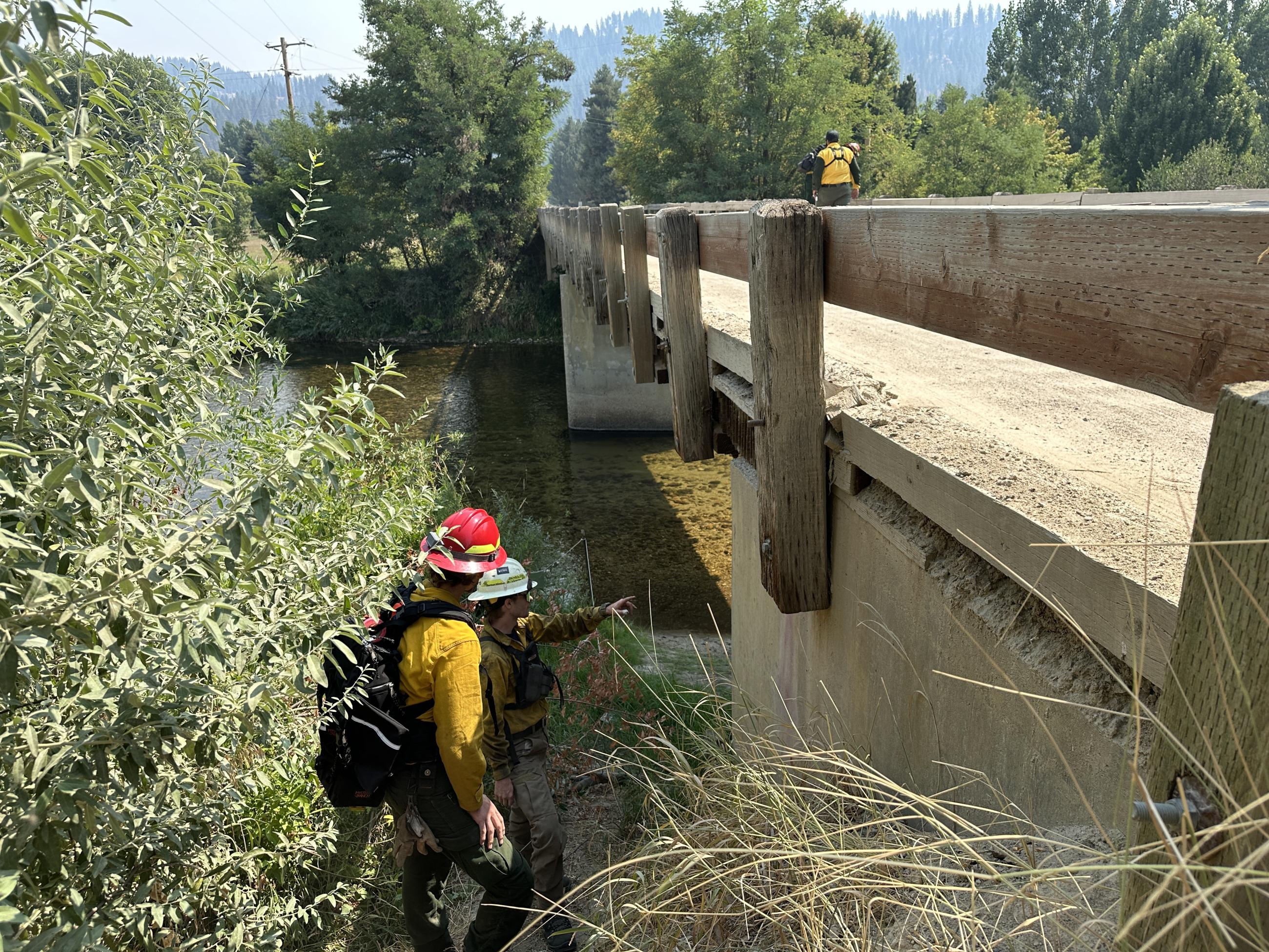 Part of the Structure Protection Group walks a bridge on the Middle Fork Road to assess its weight limit.