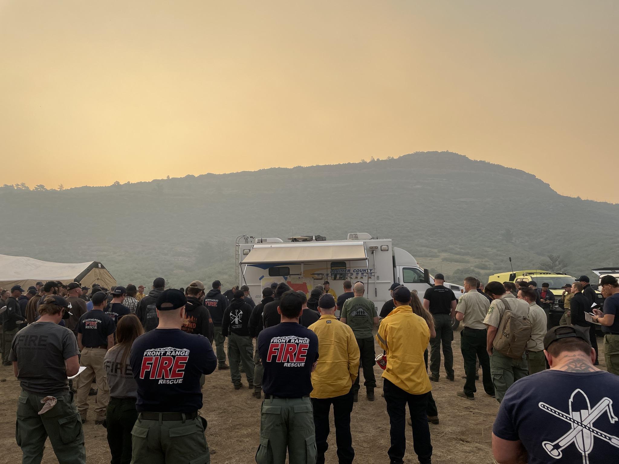 Firefighters attend morning briefing, July 31