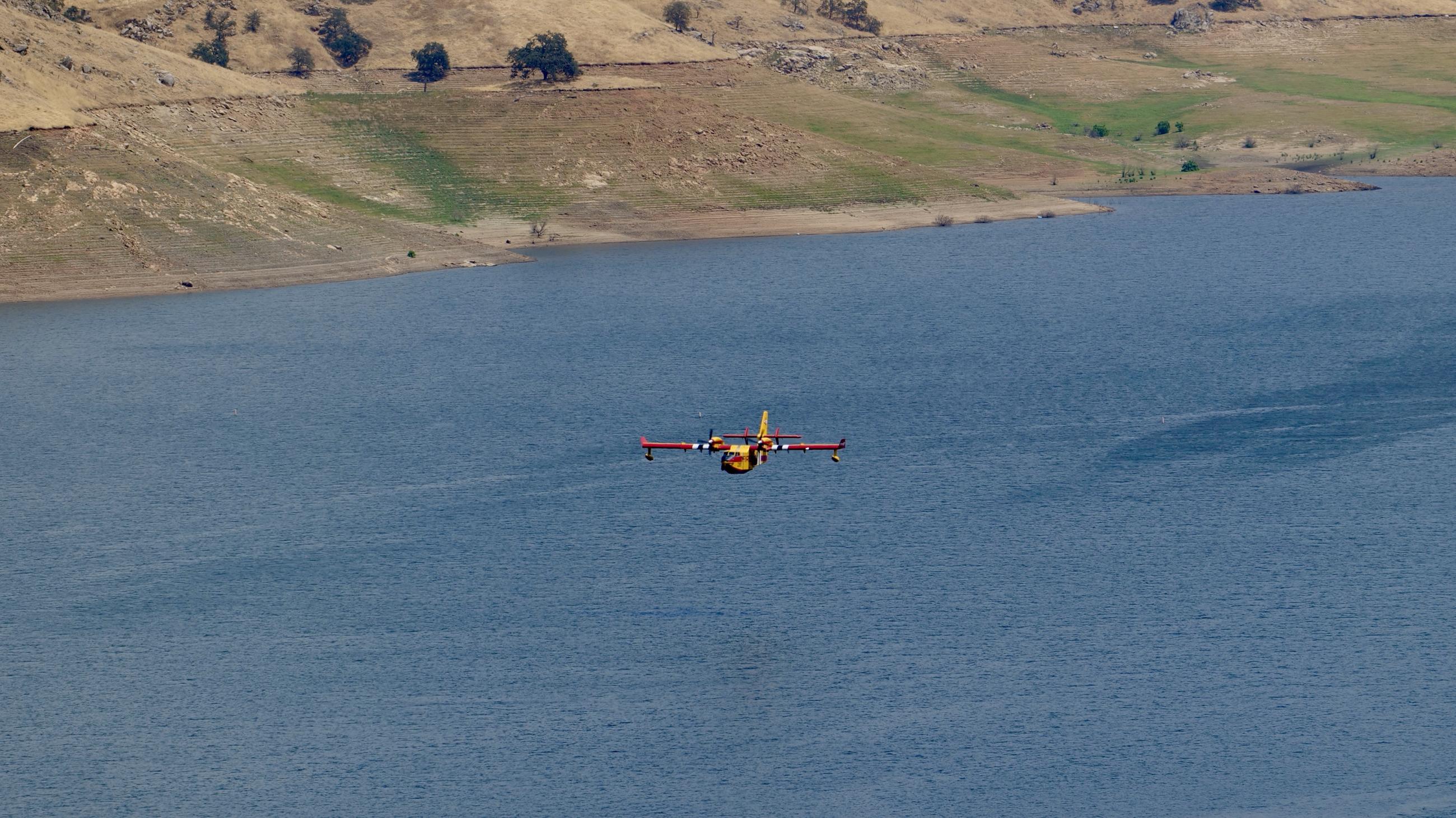 Super scooper aircraft fly above Lake Kaweah