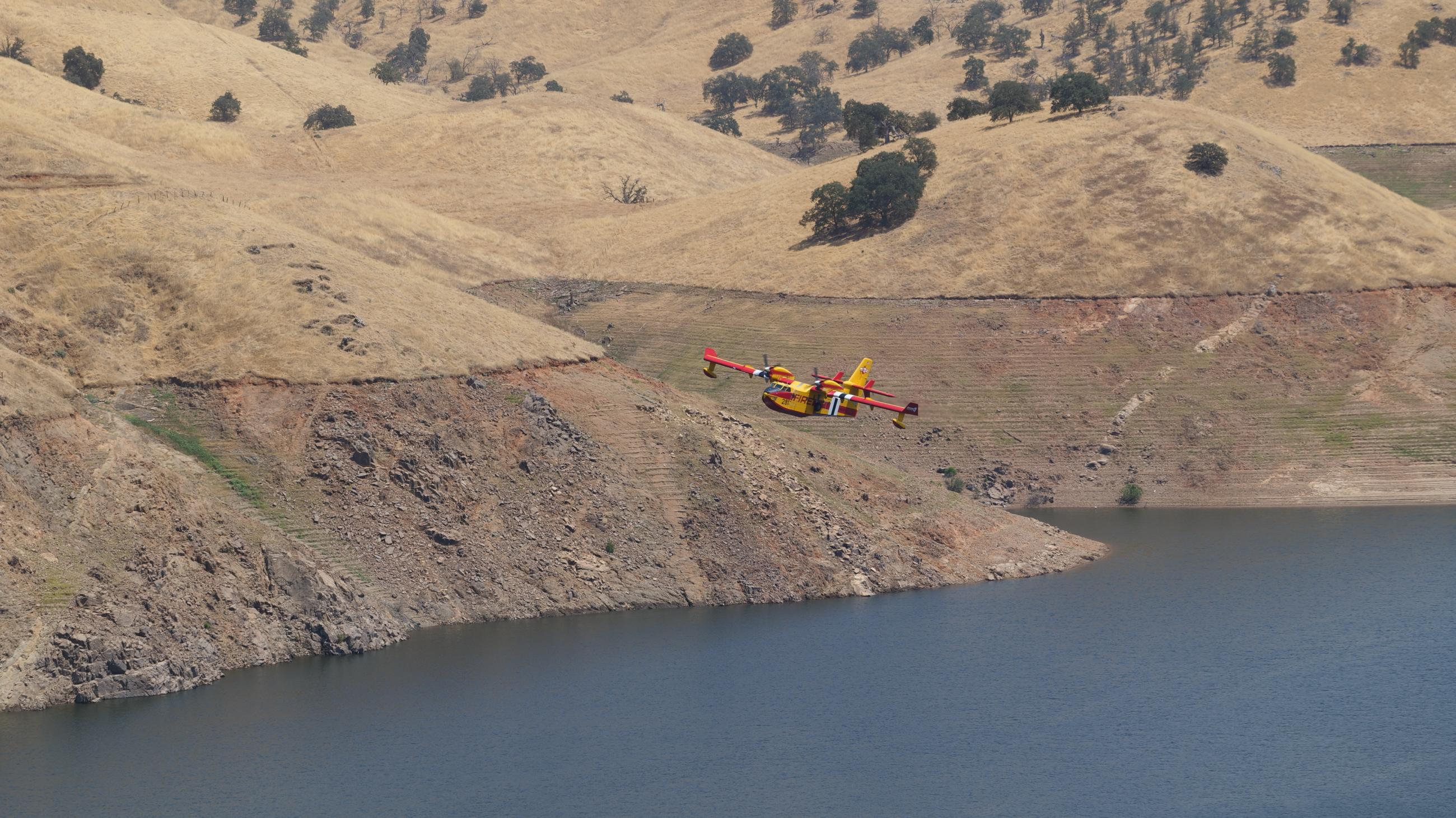 Super scooper aircraft fly above Lake Kaweah