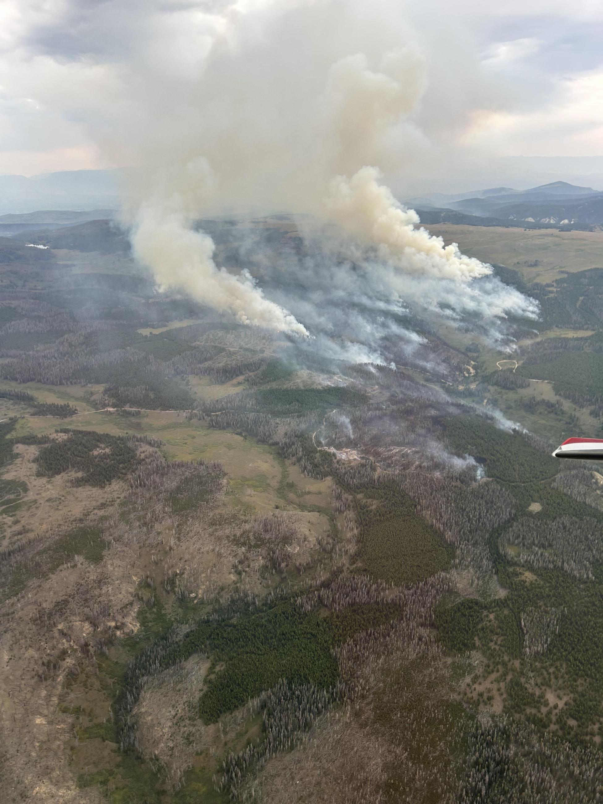 Aerial view of Leeds Creek Fire and smoke