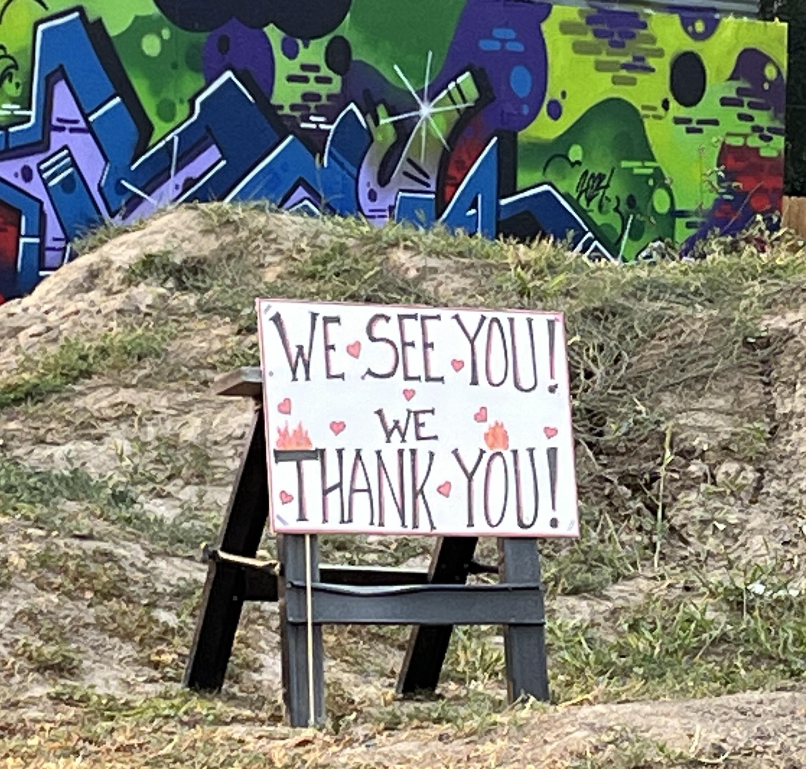 Sign saying we see you thank you 