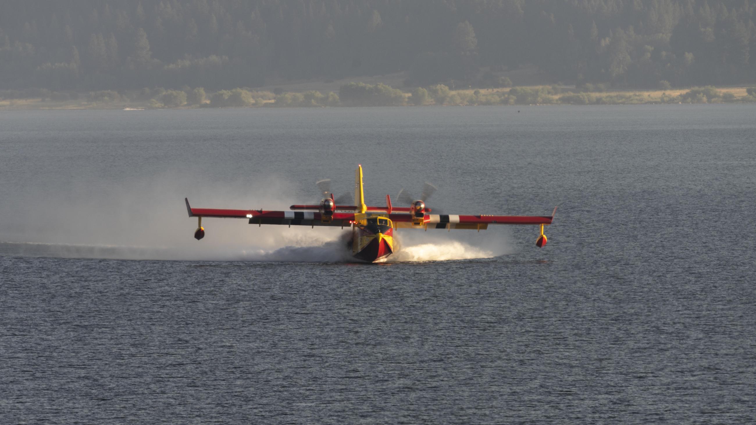 CL415 "Super Scooper" scooping water for the Wolf Creek Fire