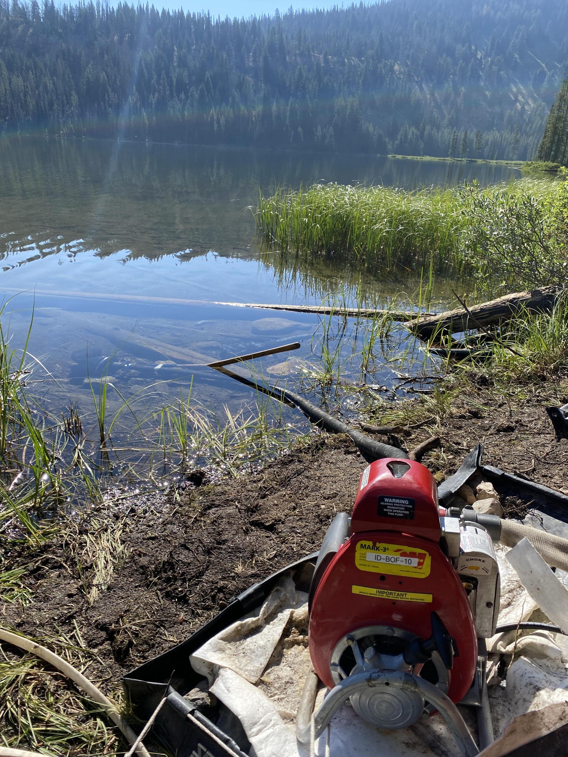 water pump with intake in a clear mountain lake