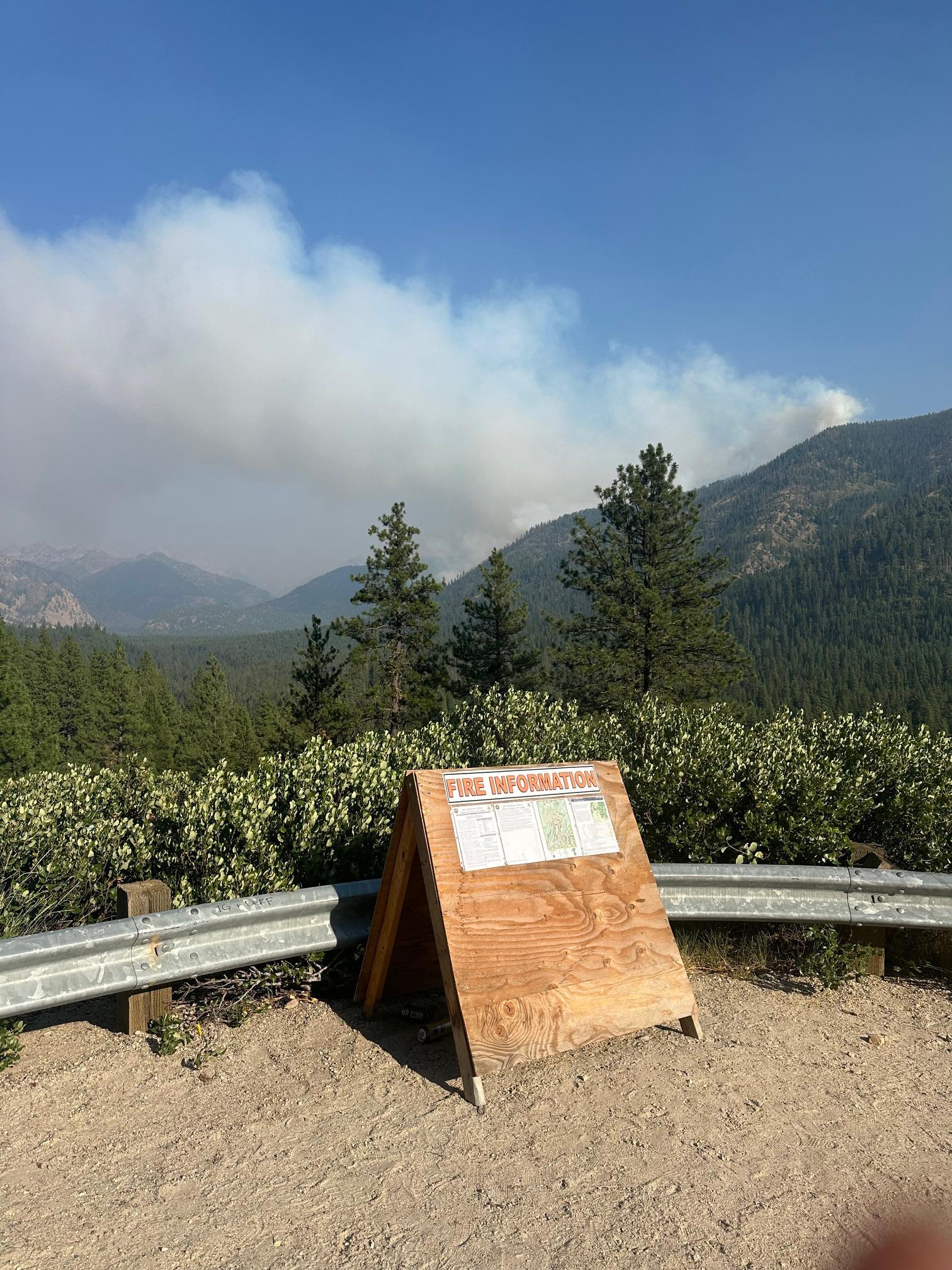 Image displays smoke rising from the Wapiti fire visible from the Grandjean overlook on Highway 21.