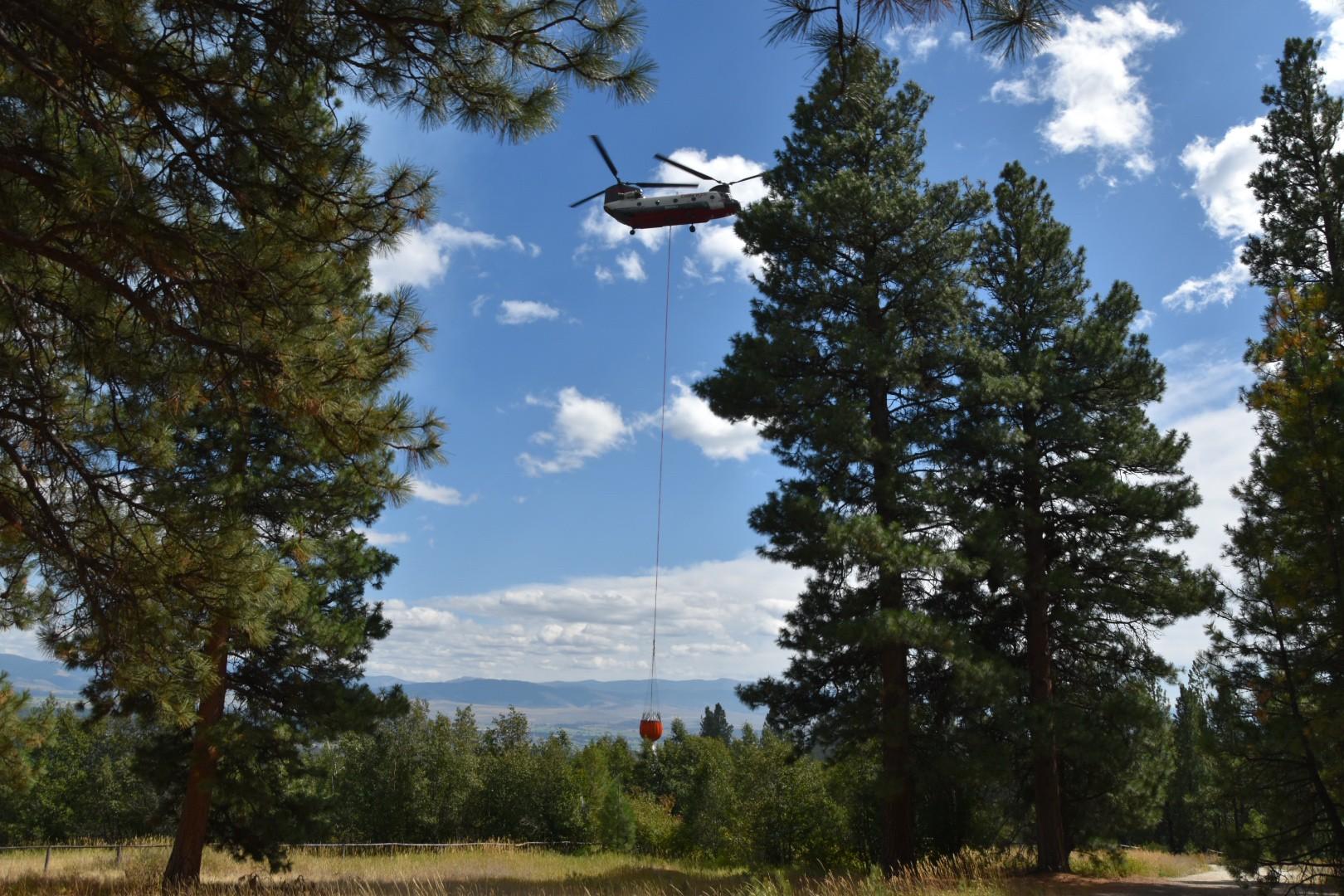 Helicopter dropping water 