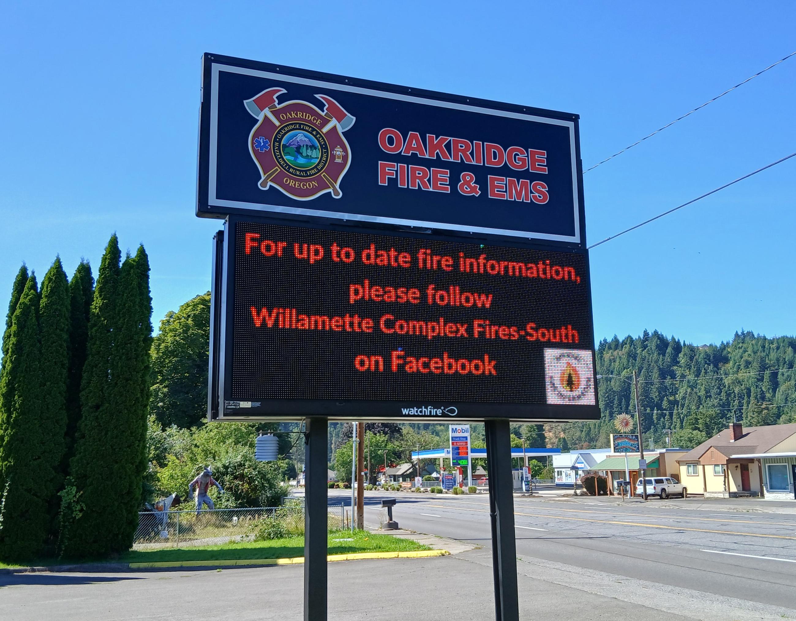 This photo shows the sign for the Oakridge, Oregon Fire and EMS station with message about the Willamette Complex Fires. 