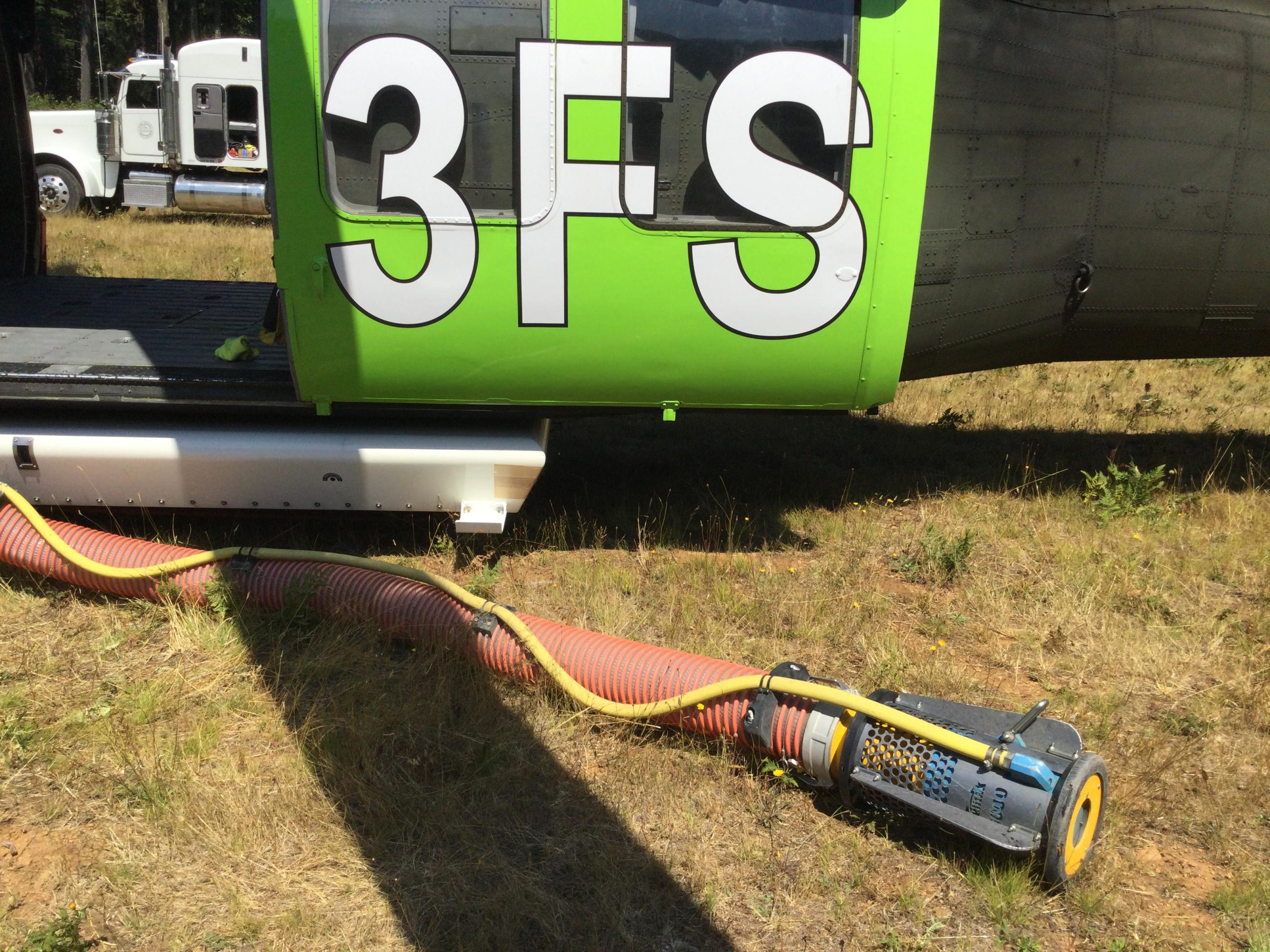 hose with foot valve on helicopter