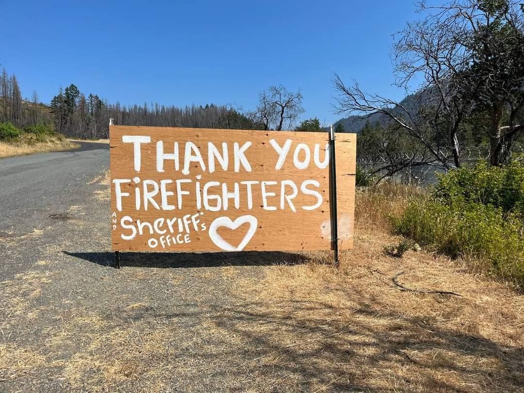 Handmade sign saying thank you firefighters and Sherrif's Office with a heart 