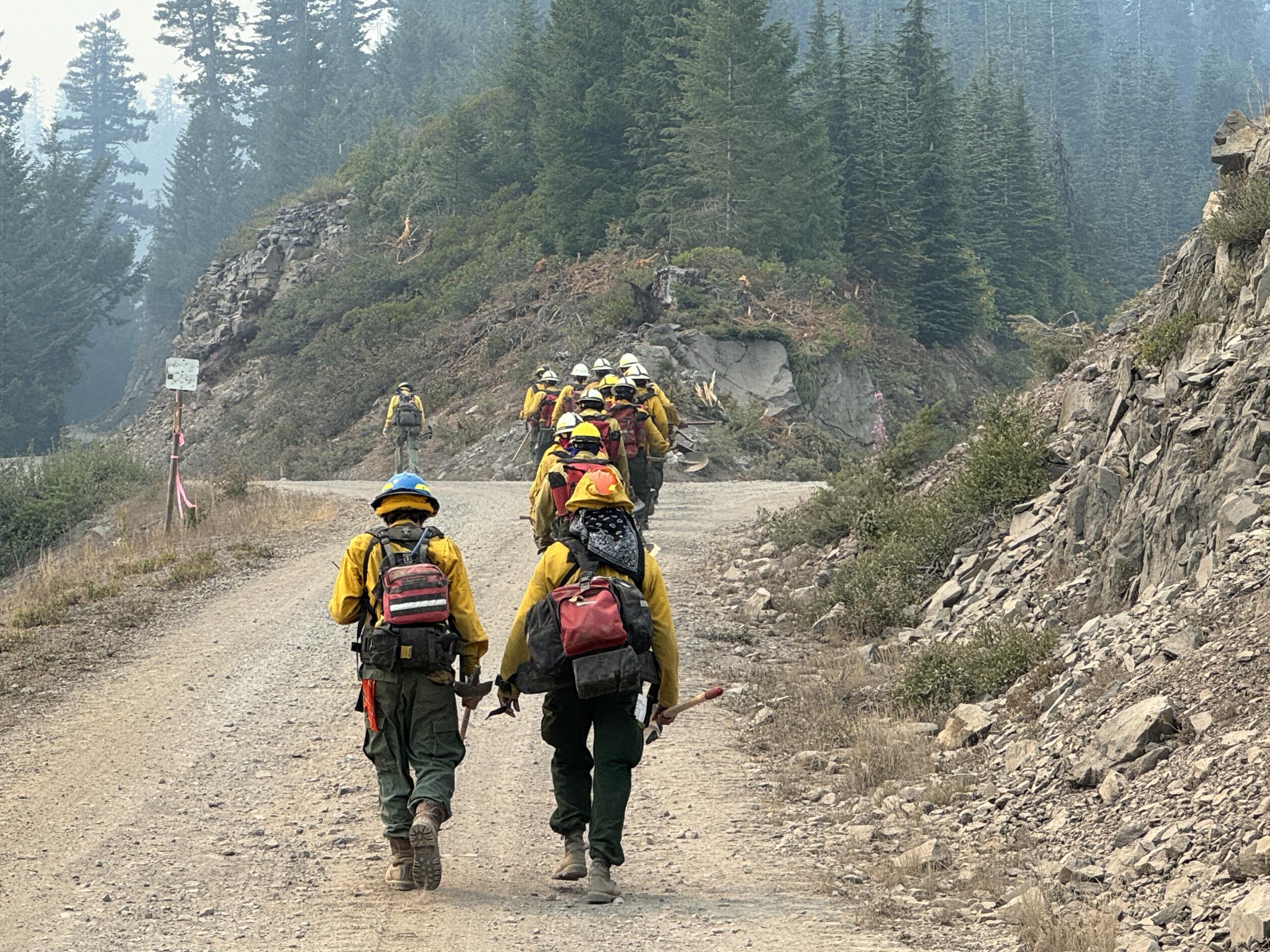 crew walking on dirt road