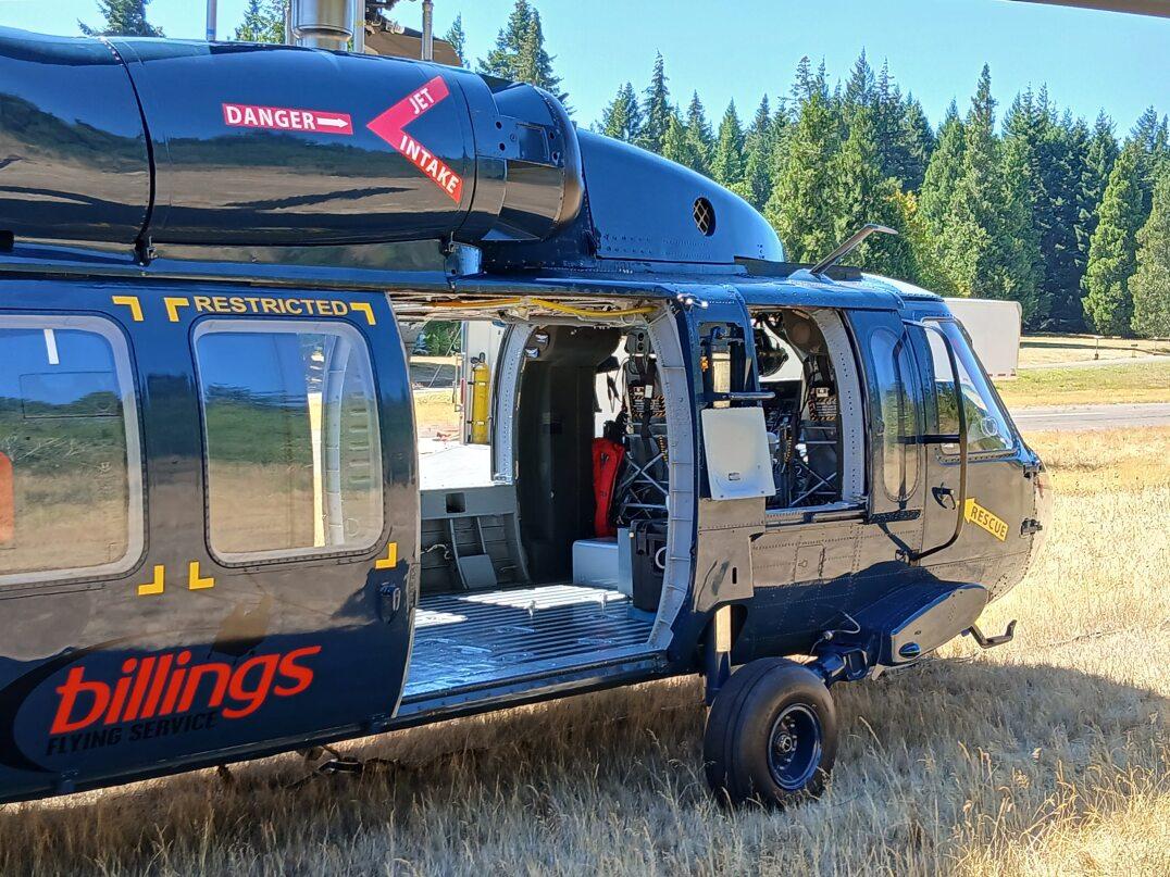 Picture of the side of a Sikorsky Blackhawk Helicopter with the side door open