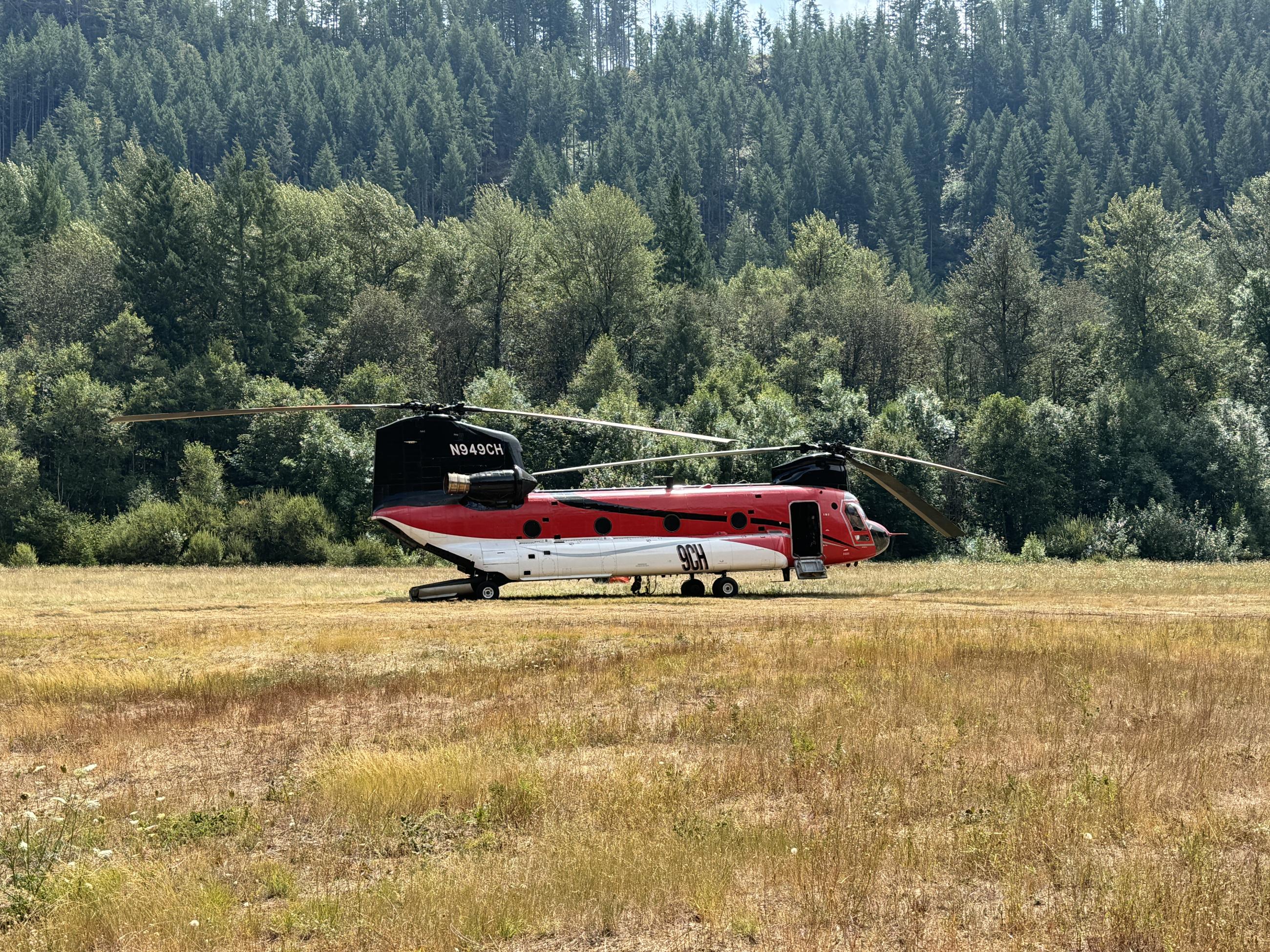 large helicopter parked in a field