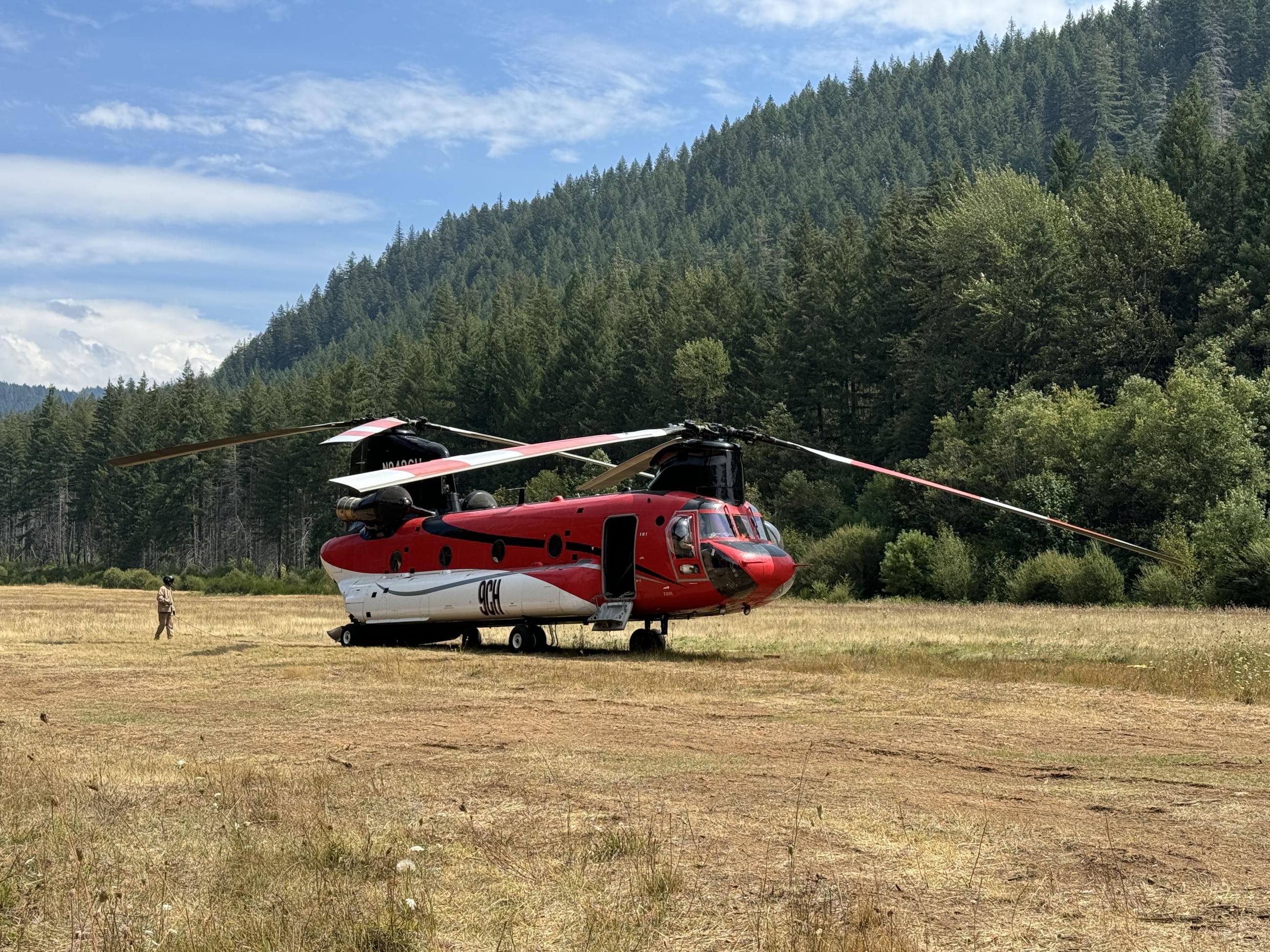 large helicopter parked in field
