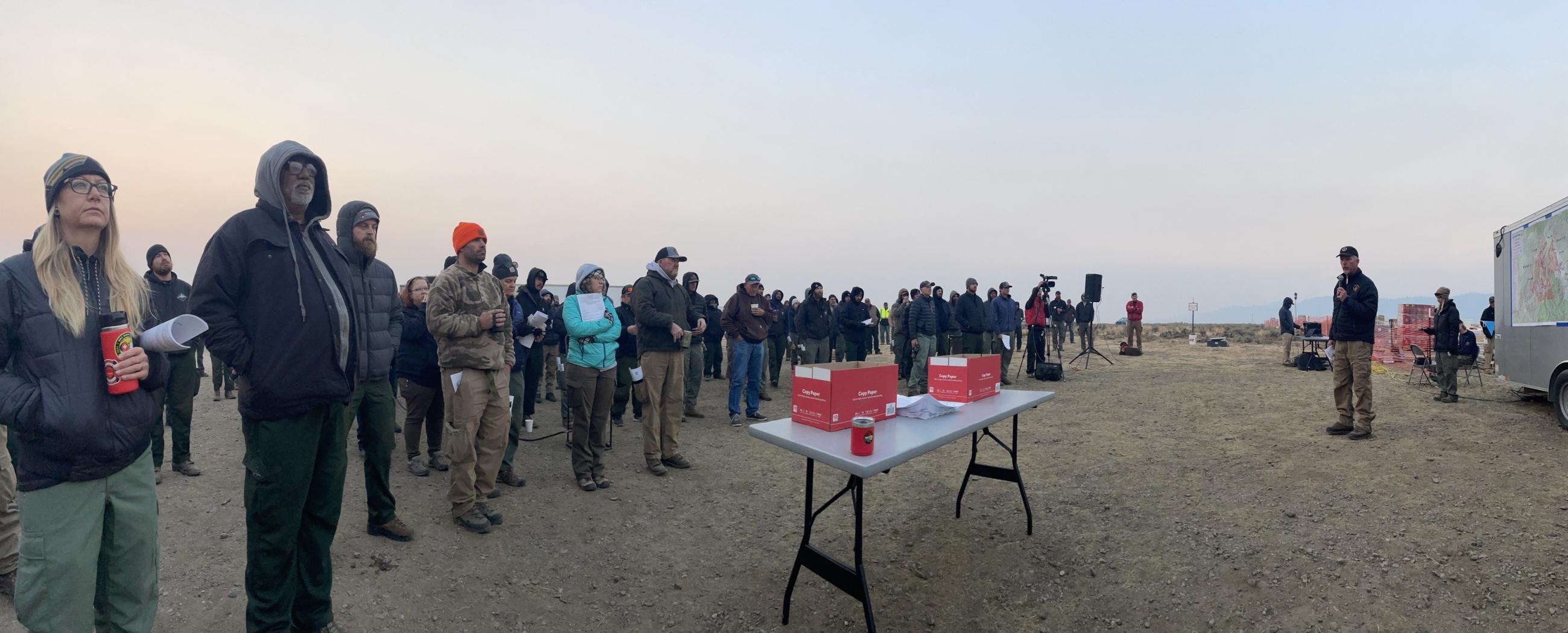 photo showing firefighters at their morning briefing 