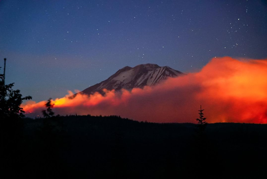 Williams Mine Fire glowing at sunset in front of Mt. Adams, 8-11-24