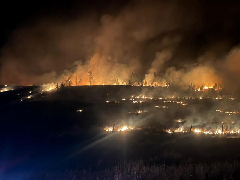 strips of flames set by firefighters at night