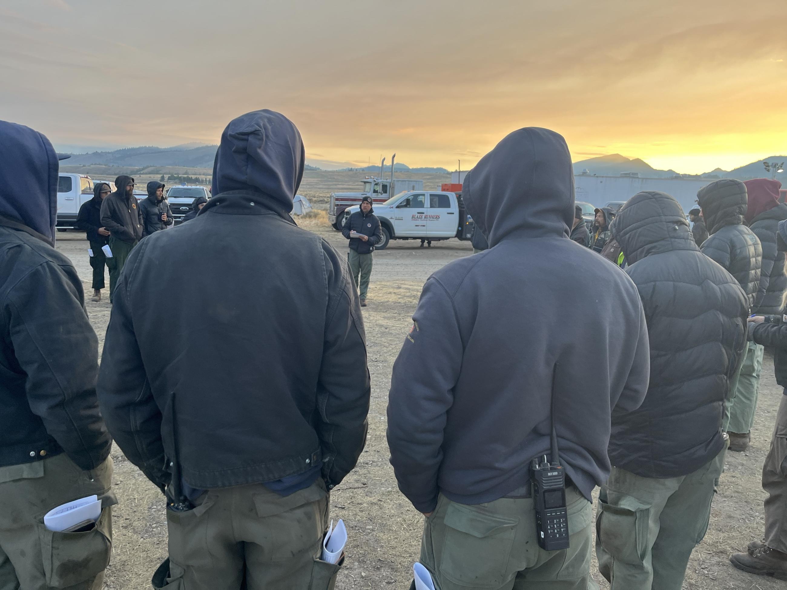 Firefighters at Morning Briefing have hoods up due to Below Freezing Temperature, Sunday, August 25