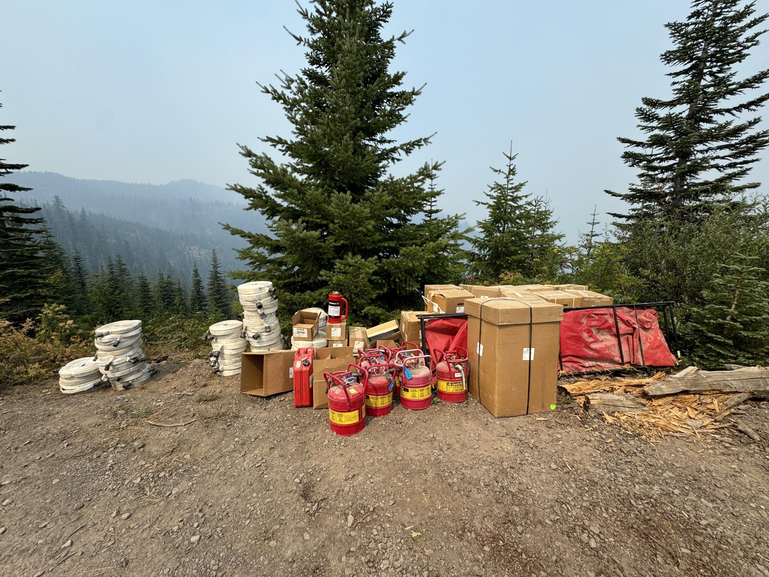 Red fuel cans other supplies in an area