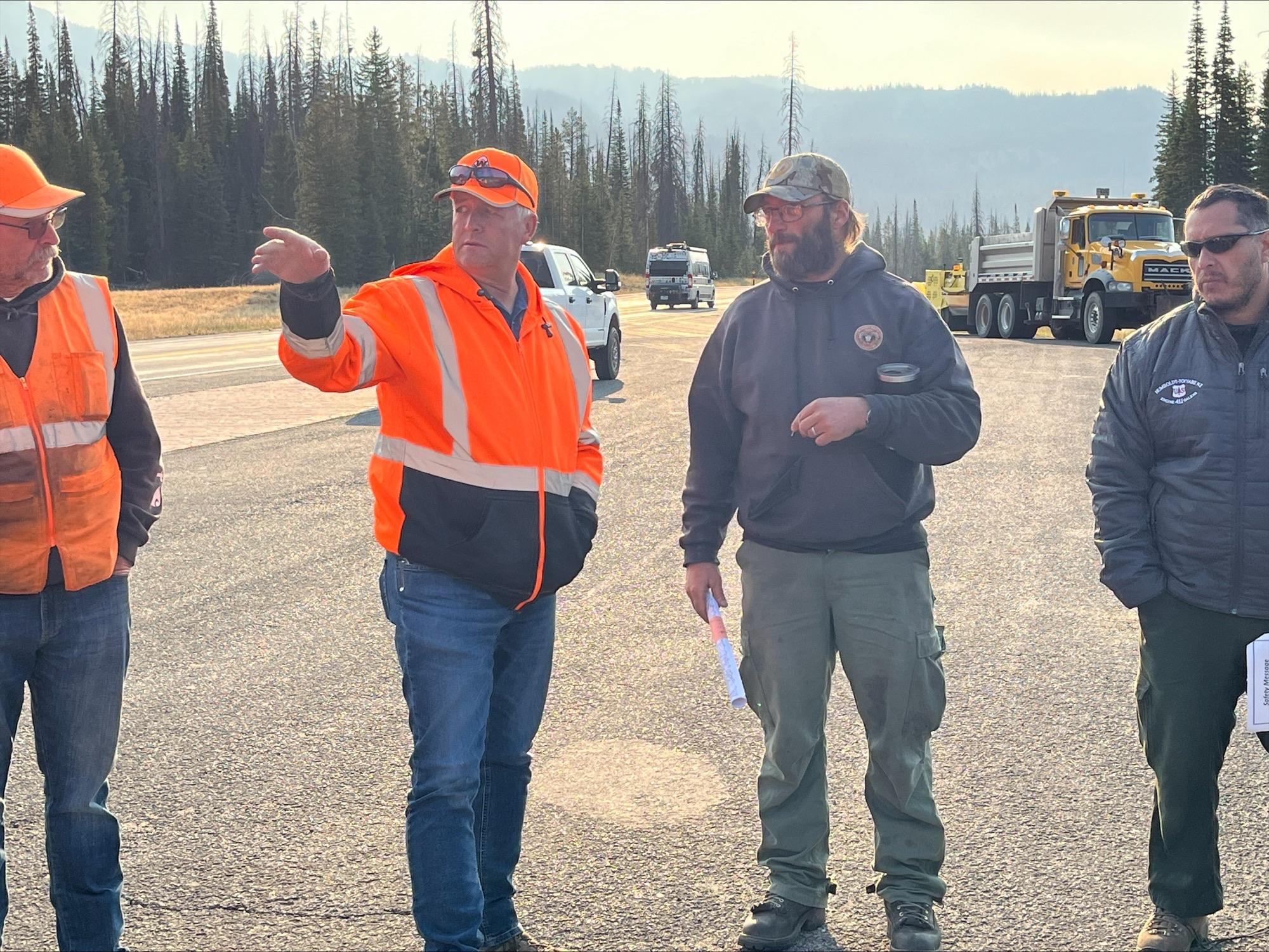 Sawyers with the Northern Rockies Incident Management team meet with Wy DoT staff ahead of hazard tree mitigation