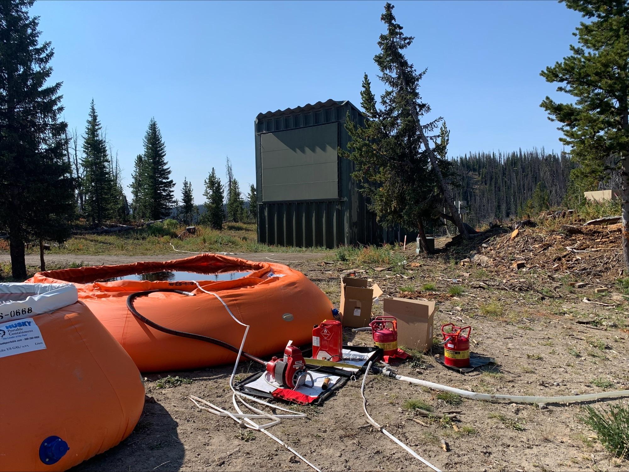 remote and portable water bladders preposition for structure protection