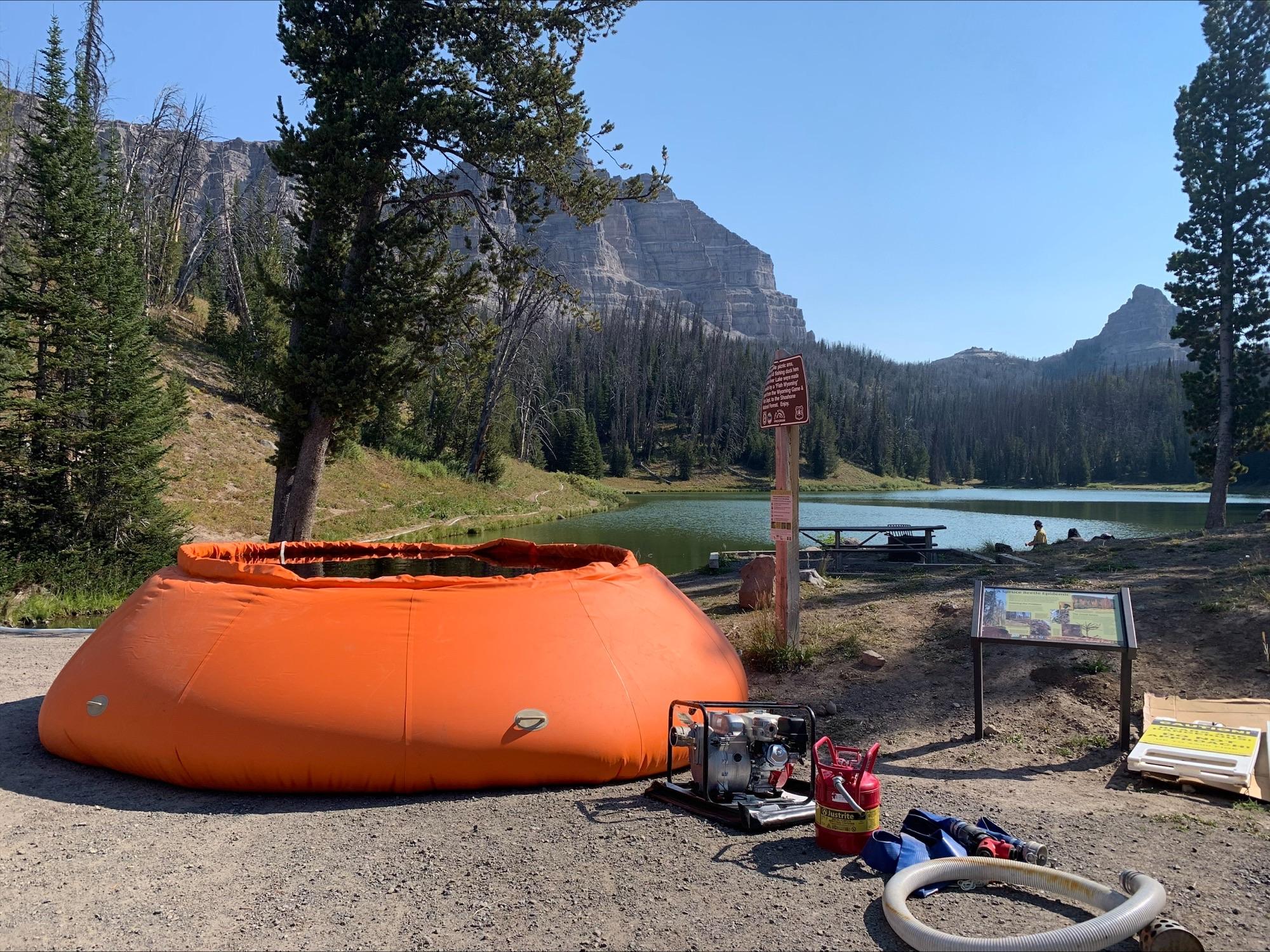 Firefighters place remote water tanks near Brooks Lake Lodge