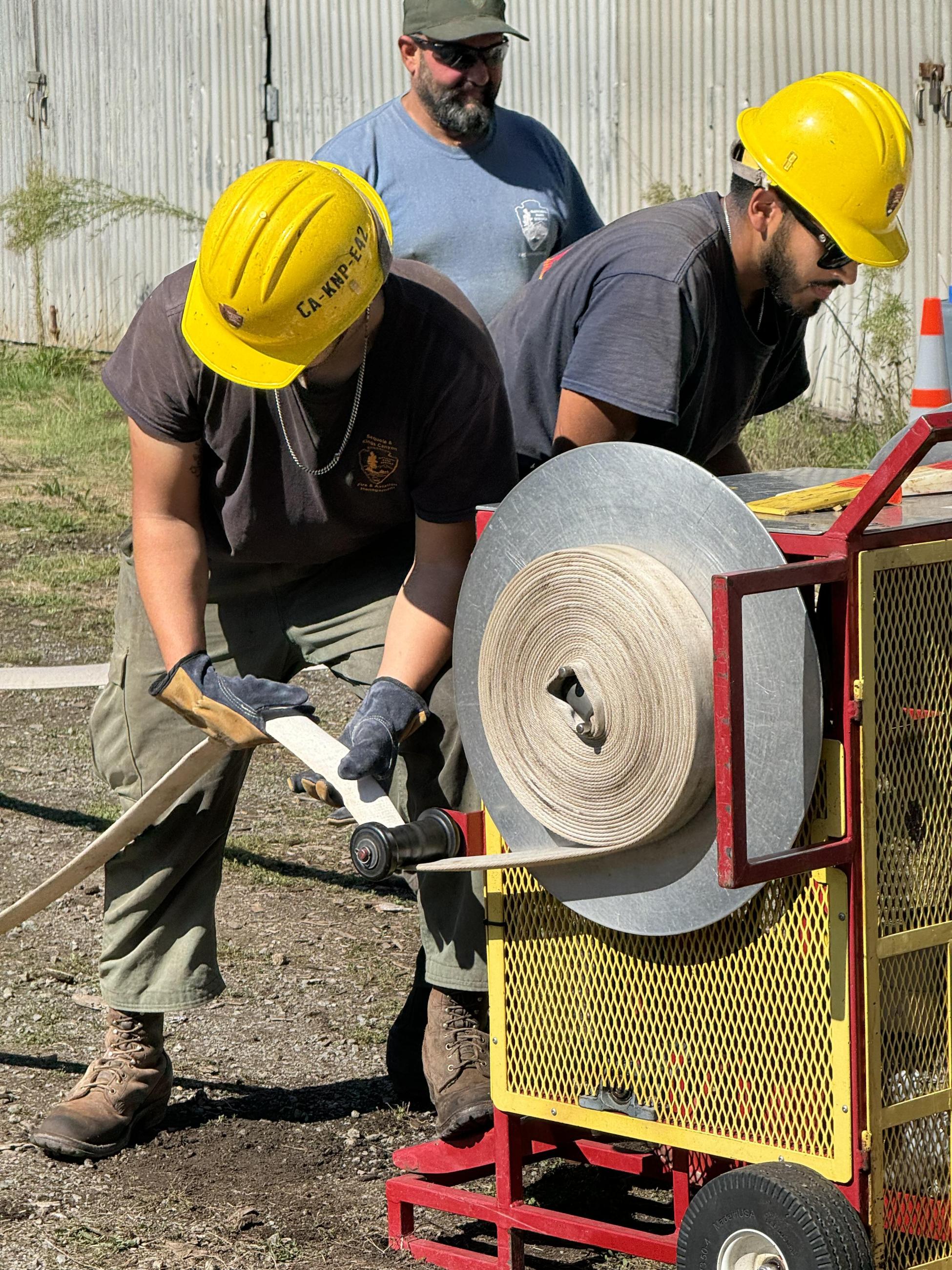 Sequoia Kings Canyon Engine Crew roll fire hose