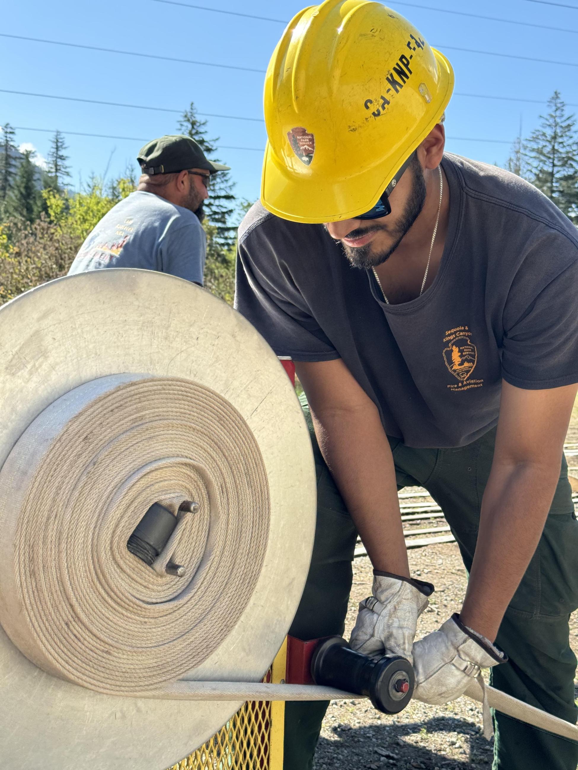 Sequoia Kings Canyon Engine Crew roll fire hose