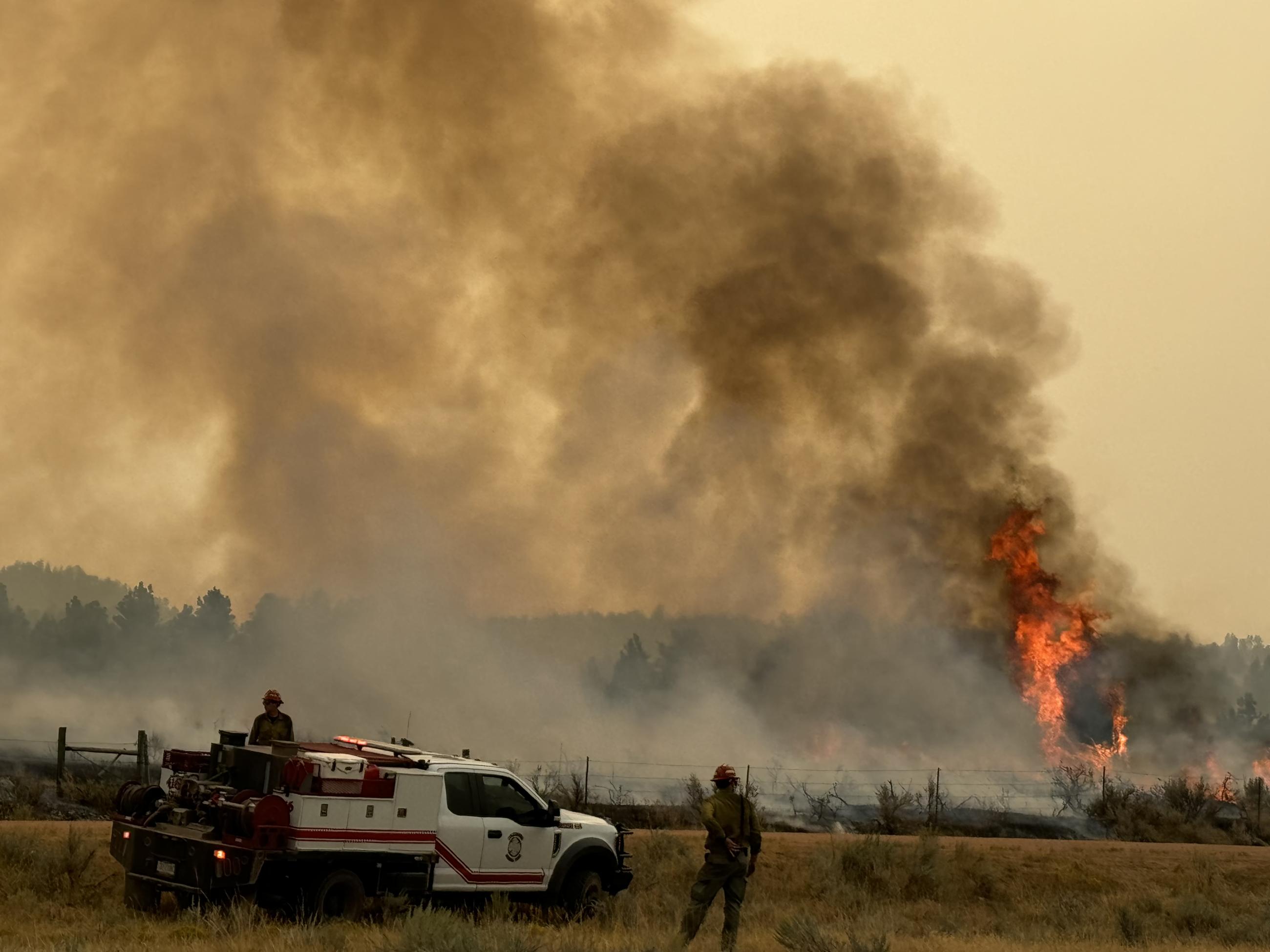 Short Draw Fire Plume with Engine and Firefighters