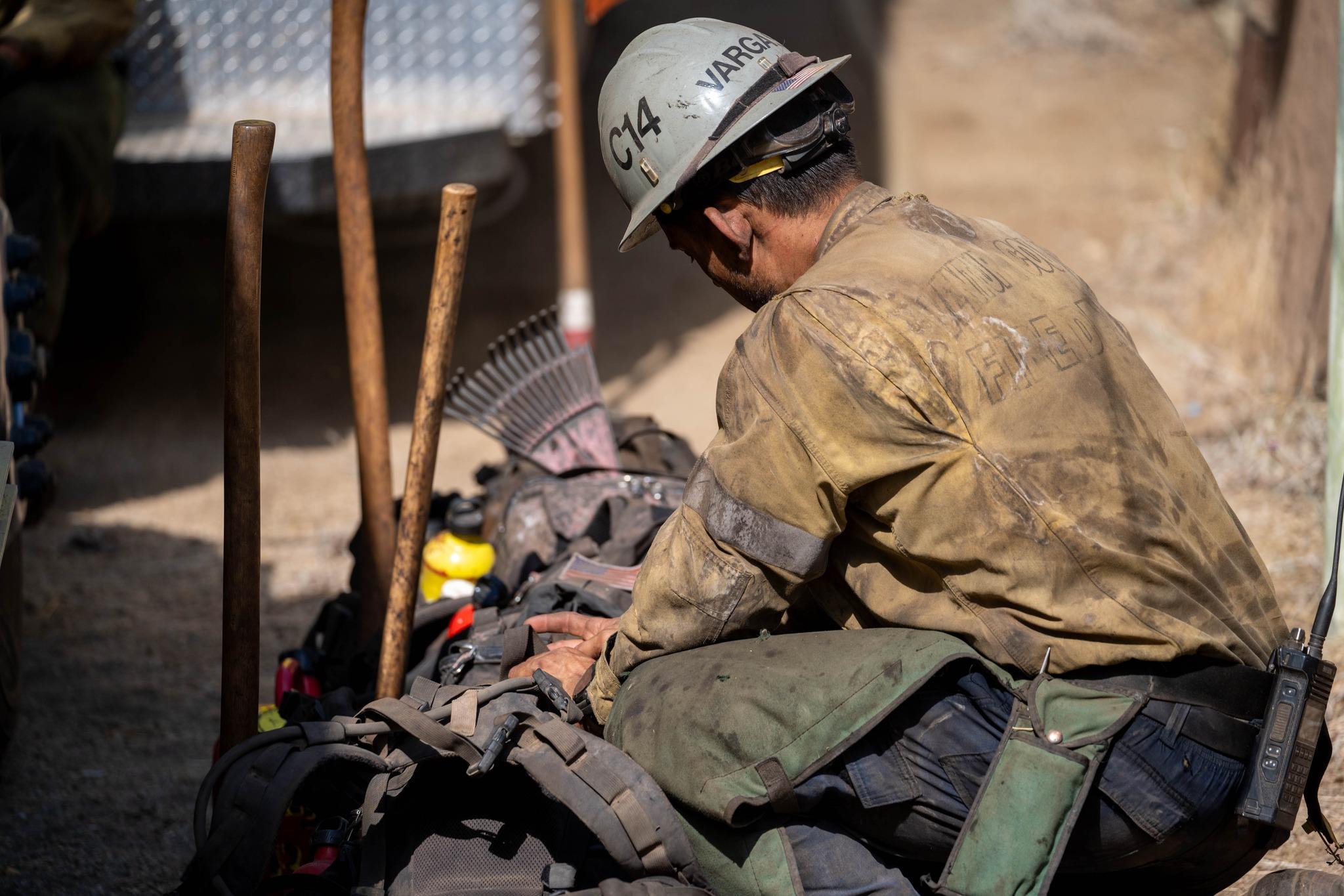 Firefighter with a helmet and bag. 