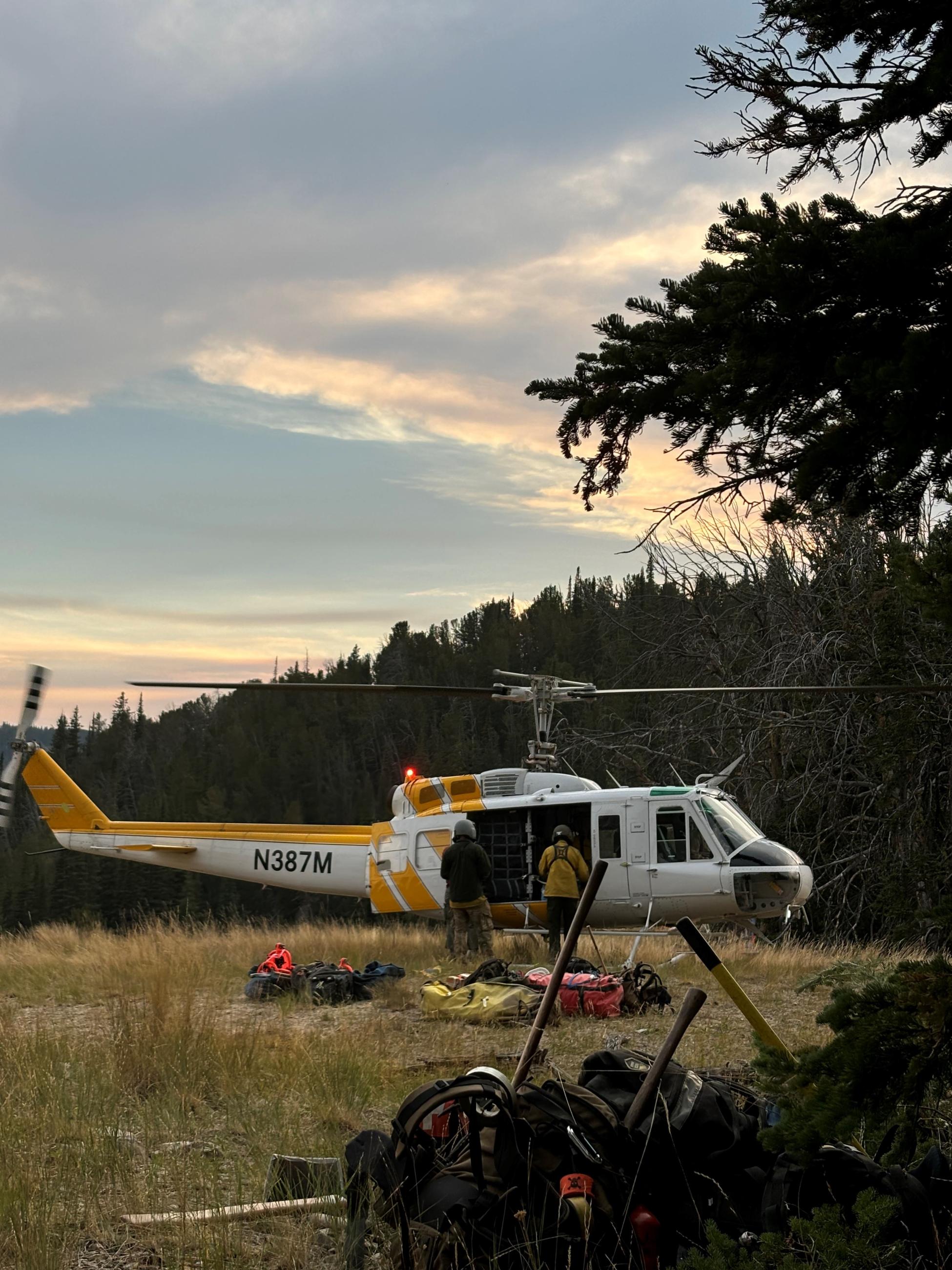 Photo of Helicopter with firefighters unloading gear 