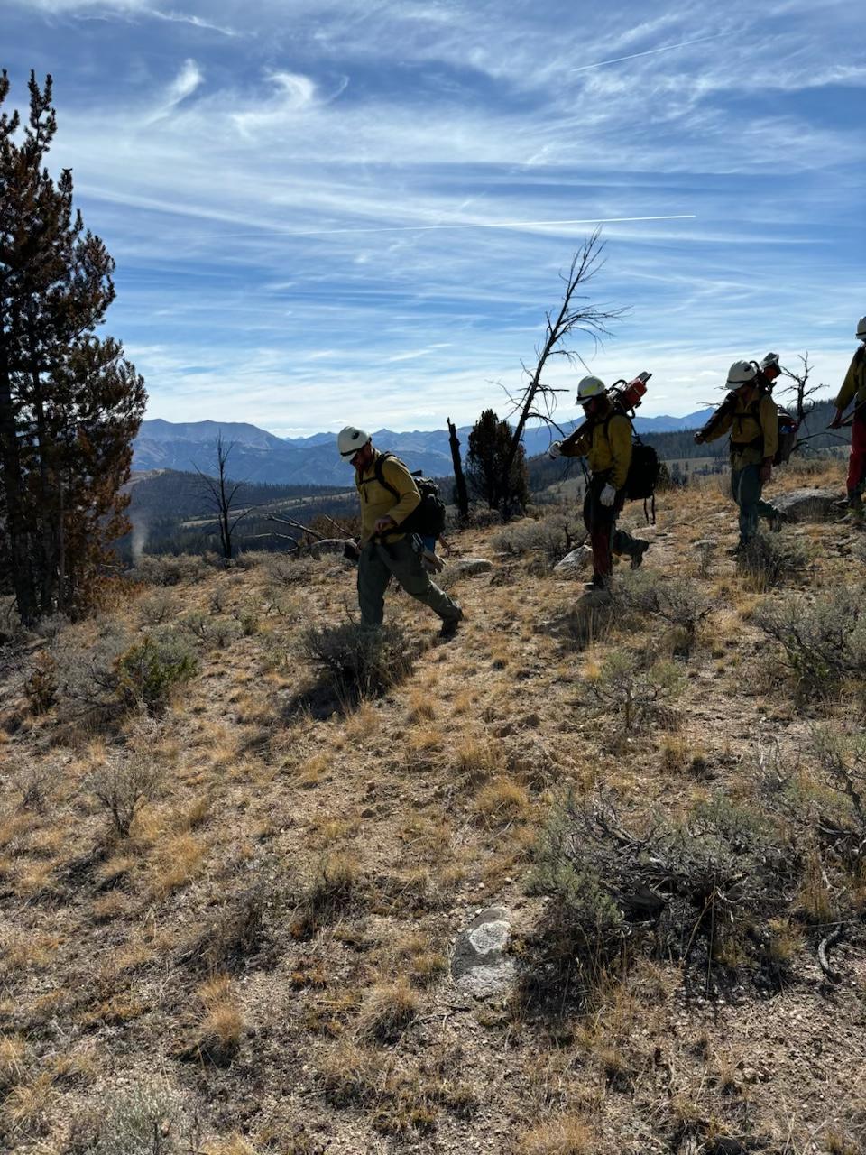 Firefighters hiking into a fire