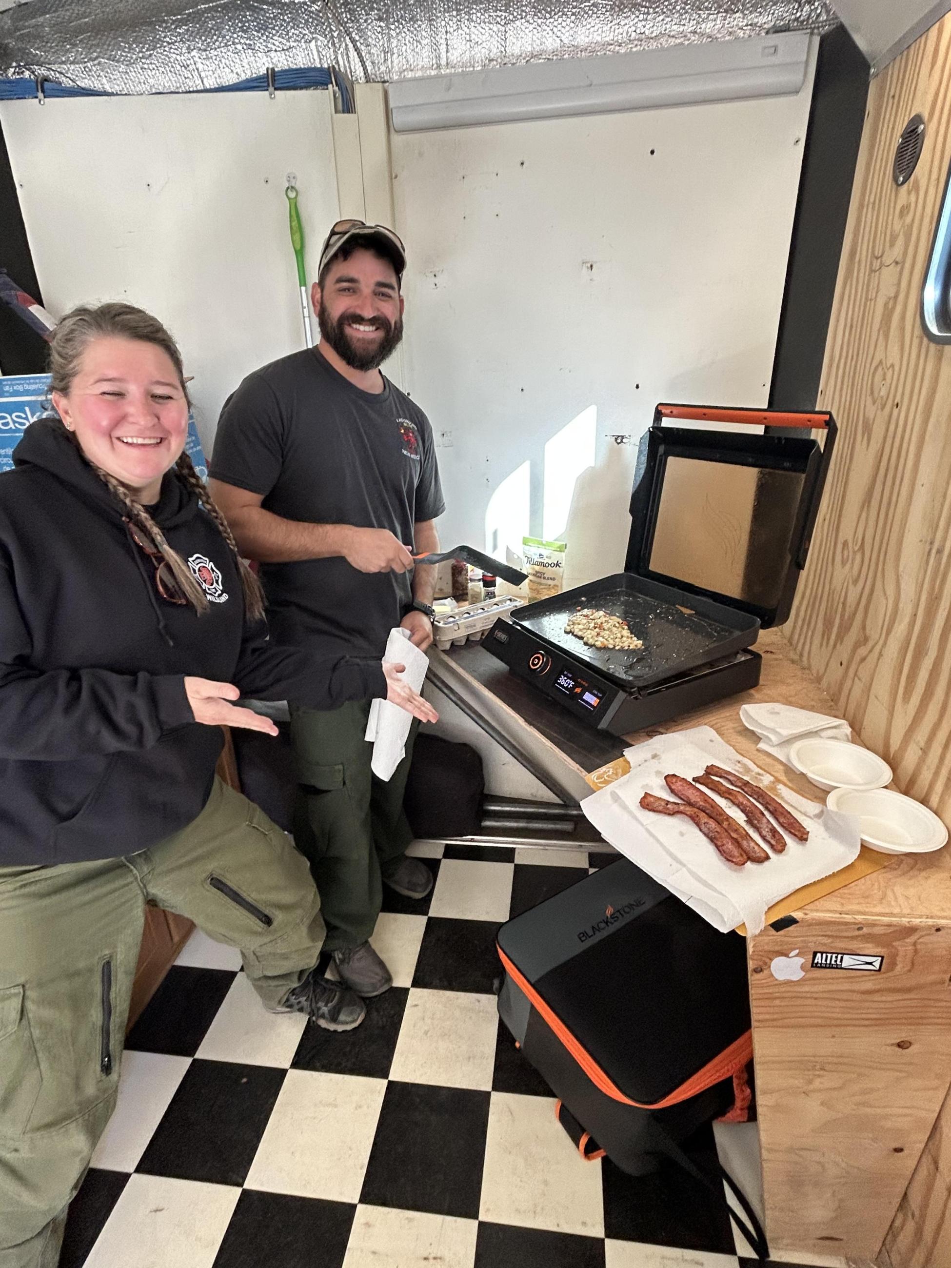 Firefighters cooking breakfast burritos