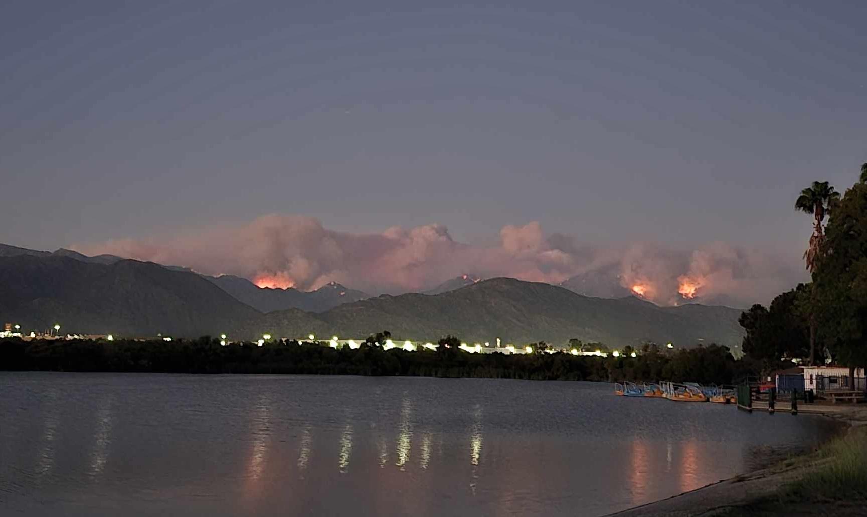 View of fire among mountain landscape.