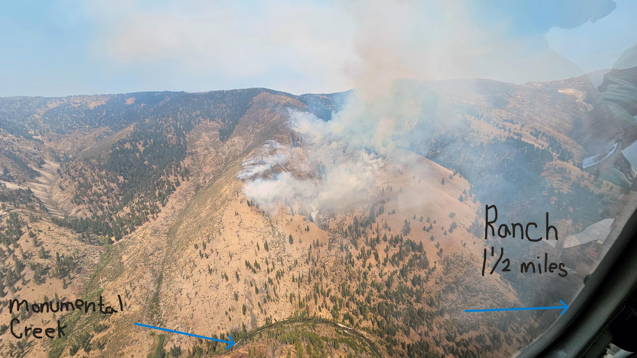 Photo shows the Copper Fire burning high above Monumental Creek.